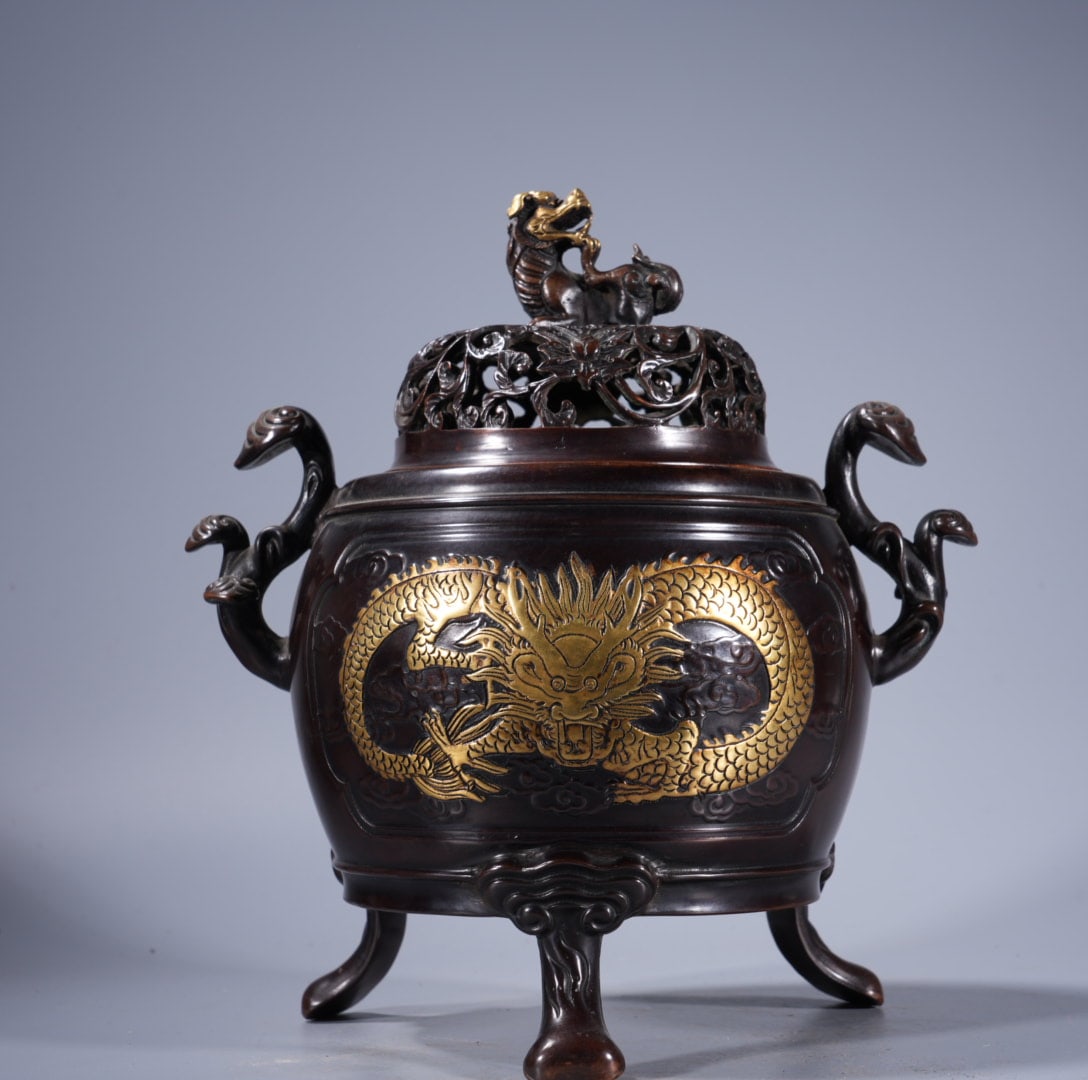 An Exquisite Gilt Bronze Relief Ruyi-Ears Censer: An Exquisite Gilt Bronze Relief Ruyi-Ears Censer,Ming Dynasty, China,Xuande Six-character Mark,Size:9.1inx4.7in ,Weight:4185g 紫铜鎏金浮雕如意耳&#