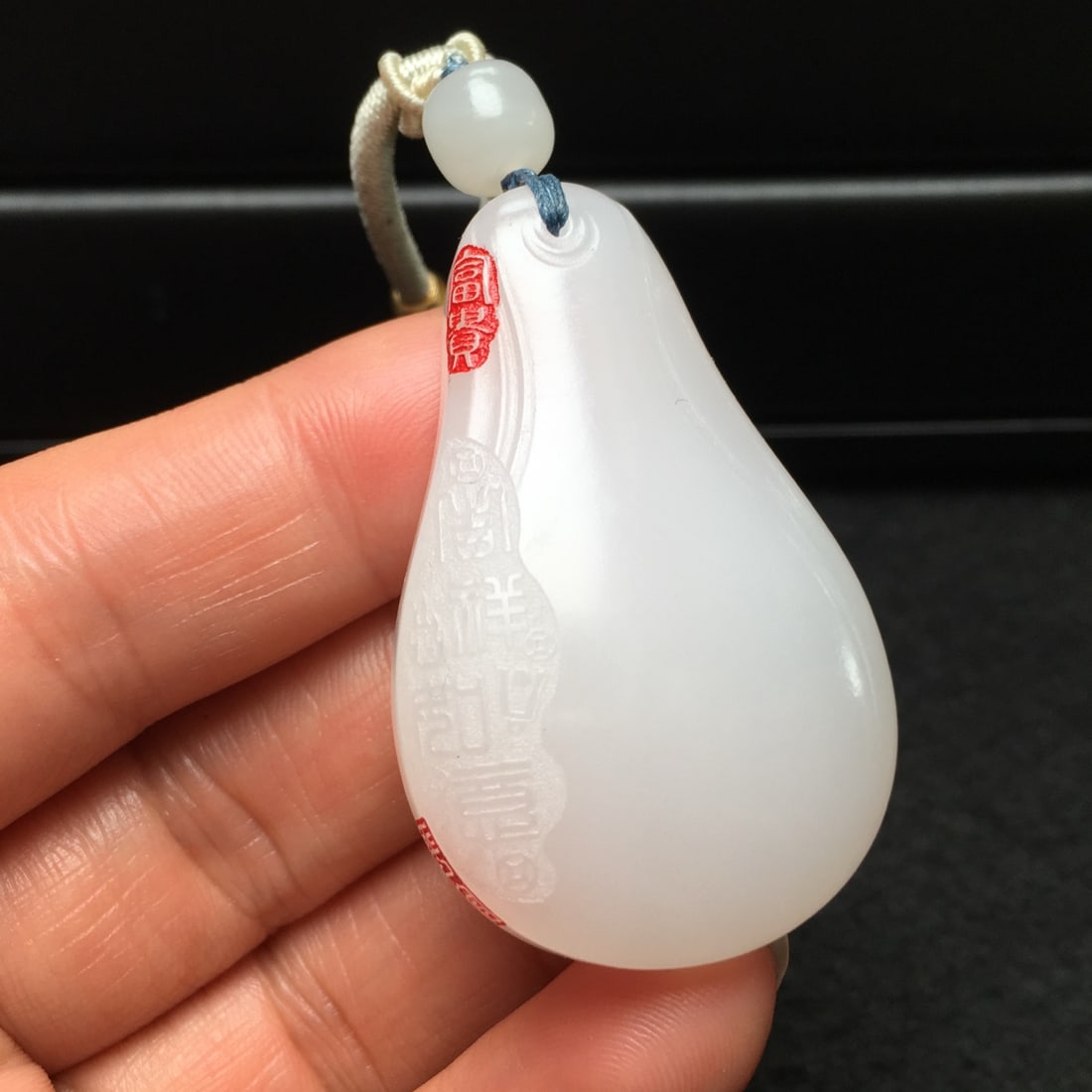 An Exquisite Hotan Jade Melon Shaped Pendant: An Exquisite Hotan Jade Melon Shaped Pendant,Qing Dynasty, China,Size:1.9inx1.2inx4.7in,Weight:27g 和田玉瓜形挂件,中国清代
