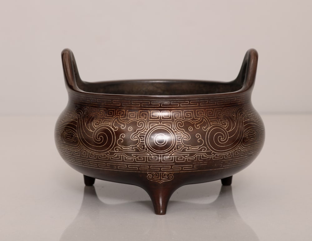 An Exquisite Bronze inlaid Silver Wire Tripod Double-Ears Censer: An Exquisite Bronze inlaid Silver Wire Tripod Double-Ears Censer,Ming Dynasty, China,With Mark,Size:3.5inx4.5in,Weight:1012g