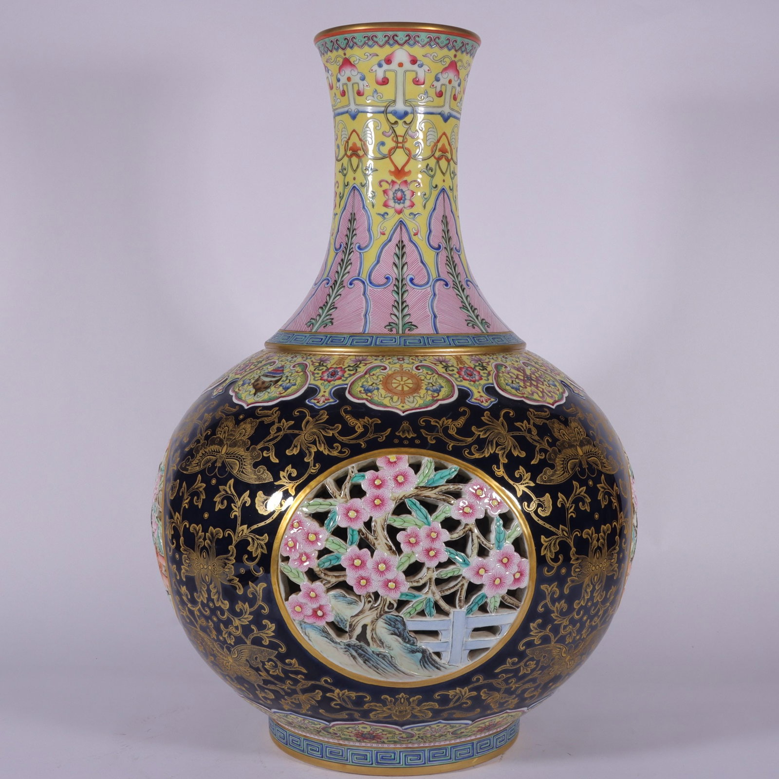 An Exquisite Famille-Rose Ji Blue Glazed Painted Gold Yellow Ground Flower Pattern Vase: An Exquisite Famille-Rose Ji Blue Glazed Painted Gold Yellow Ground Flower Pattern Vase,Qing Dynasty, China,Qianlong Four-character Mark,Size:20.9inx4.8inx12.6inx7.5in 粉彩霁蓝