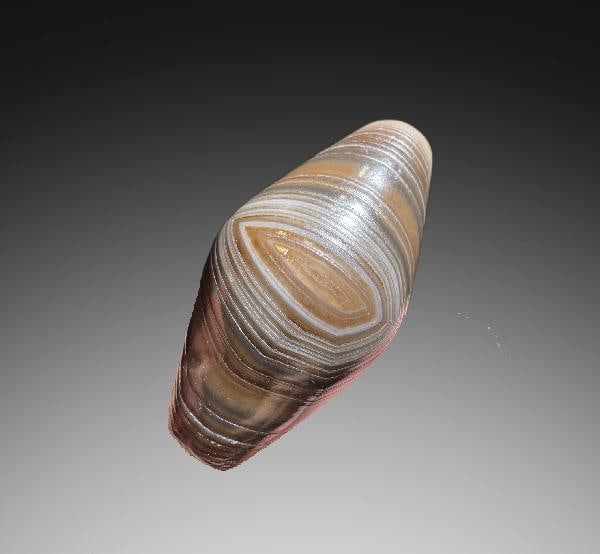 An Exquisite Silk-Wrapped Buddha-Eye Dzi bead: An Exquisite Silk-Wrapped Buddha-Eye Dzi bead,Qing Dynasty, China,Size:0.7inx1.3in 缠丝佛眼天珠,中国清代