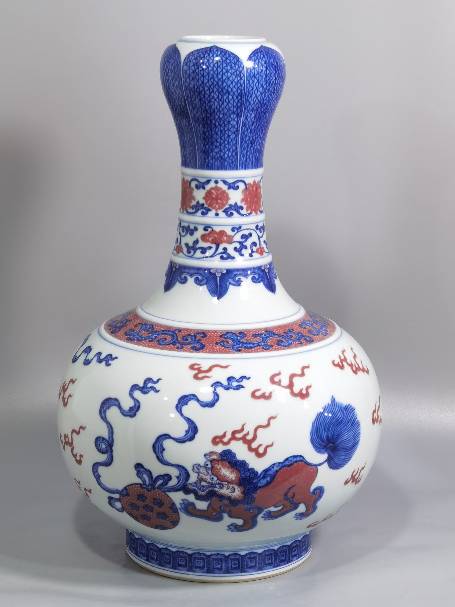 An Exquisite Blue and White Underglaze-Red Lion Pattern Vase: An Exquisite Blue and White Underglaze-Red Lion Pattern Vase,Qing Dynasty, China,Qianlong Six-character Mark,Size:14.6inx9.3in 青花釉里红狮纹瓶,中