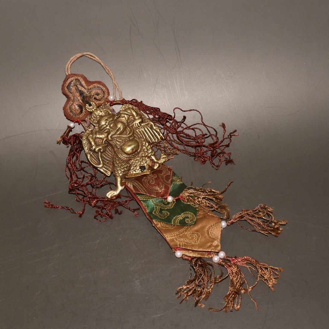 An Exquisite Bronze Bird‑Face Hanging Ornament: An Exquisite Bronze Bird‑Face Hanging Ornament,Qing Dynasty, China,Size:3.5inx3.1inx0.4inx12.2in,Weight:110g