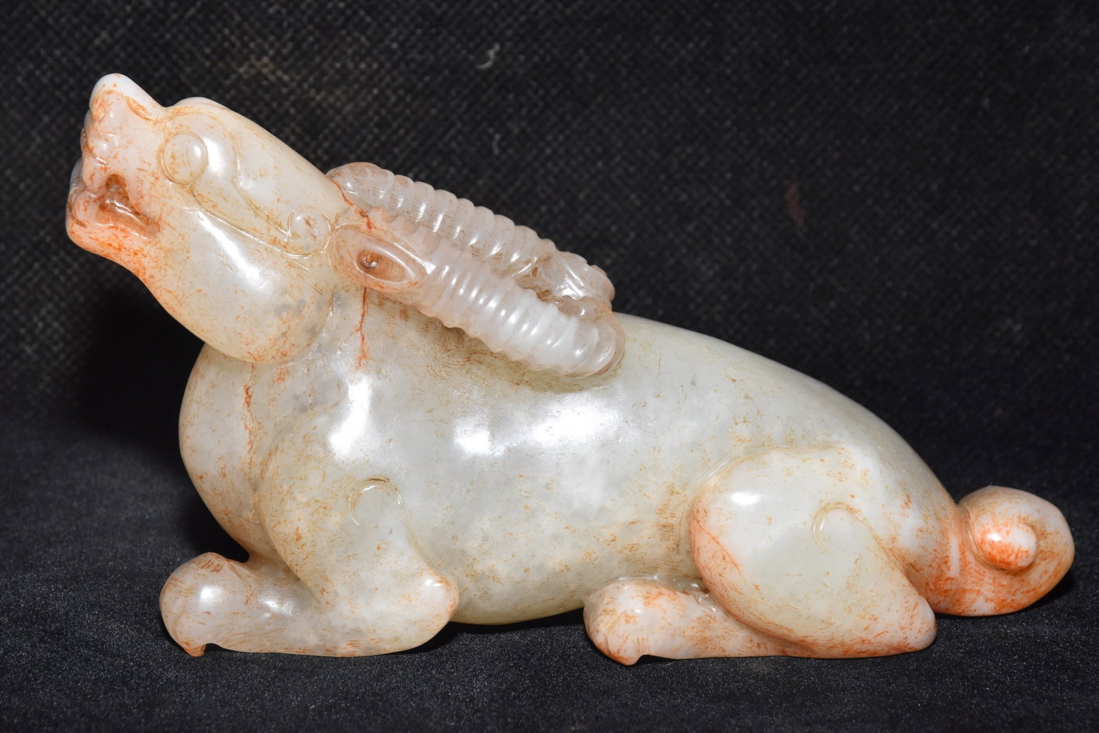 An Exquisite White Jade Buffalo Ornament: An Exquisite White Jade Buffalo Ornament,Qing Dynasty,China,Size:4.9inx3in,Weight:300g白玉牛摆件,中国清代,Size:12.5cmx7.5cm,Weight:300g