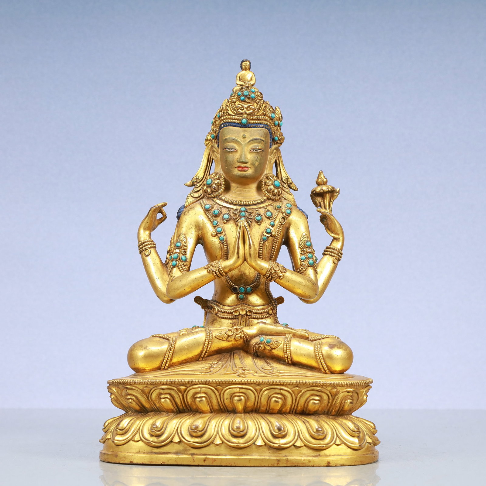 A Exquisite Gilt Bronze Four-arms Statue of Avalokitesvara: A Exquisite Gilt Bronze Four-arms Statue of Avalokitesvara Ming Dynasty, China Size:8.7inx5.9inx12.2in Weight:4300g铜鎏金四臂观音