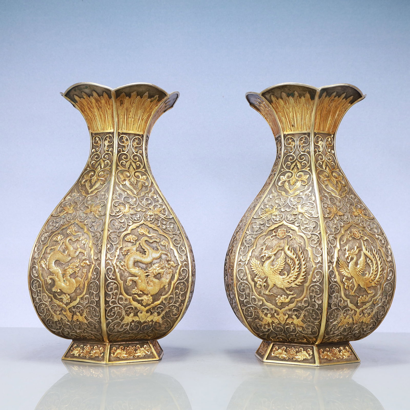 A Exquisite A pair of Gilt Silver Lotus Pattern Dragon and Phoenix Pattern Vase: A Exquisite A pair of Gilt Silver Lotus Pattern Dragon and Phoenix Pattern Vase Tang Dynasty, China Zhenguan Four-character Mark Size:8.3inx14.6in Weight:7600g一对银鎏金&