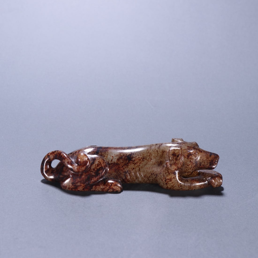 An Exquisite White Jade Dog Ornament: An Exquisite White Jade Dog Ornament,Qing Dynasty,China,Size:4.3inx1in,Weight:113.6g白玉狗摆件,中国清代,Size:10.8cmx2.6cm,Weight:113.6g