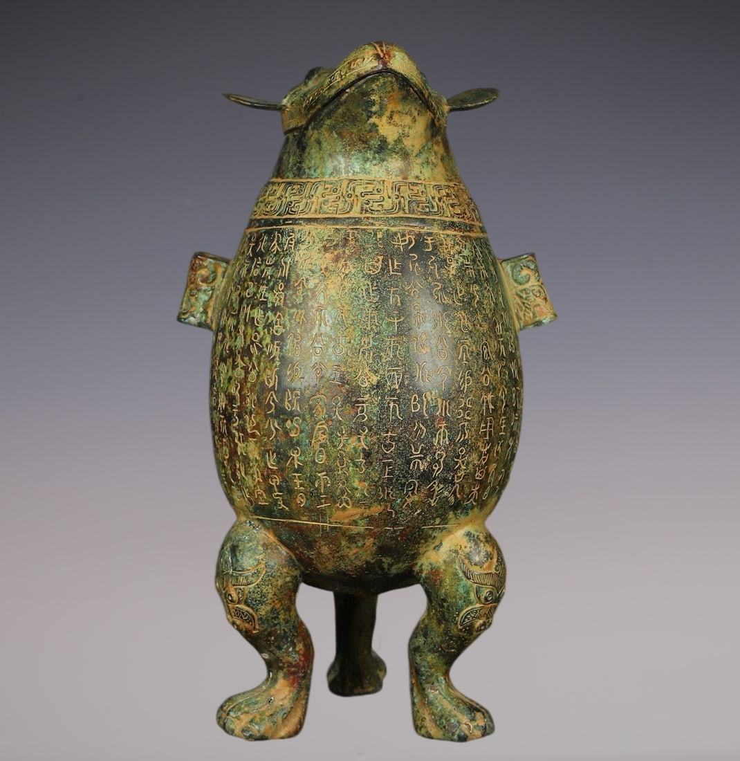An Archaic Bronze Inscription Beast-Face Pattern Double-Ears and Tripod Pot: An Archaic Bronze Inscription Beast-Face Pattern Double-Ears and Tripod Pot,W.Zhou , China,Size:9.8inx17.7in,Weight:6000g青铜铭文兽面纹双耳三