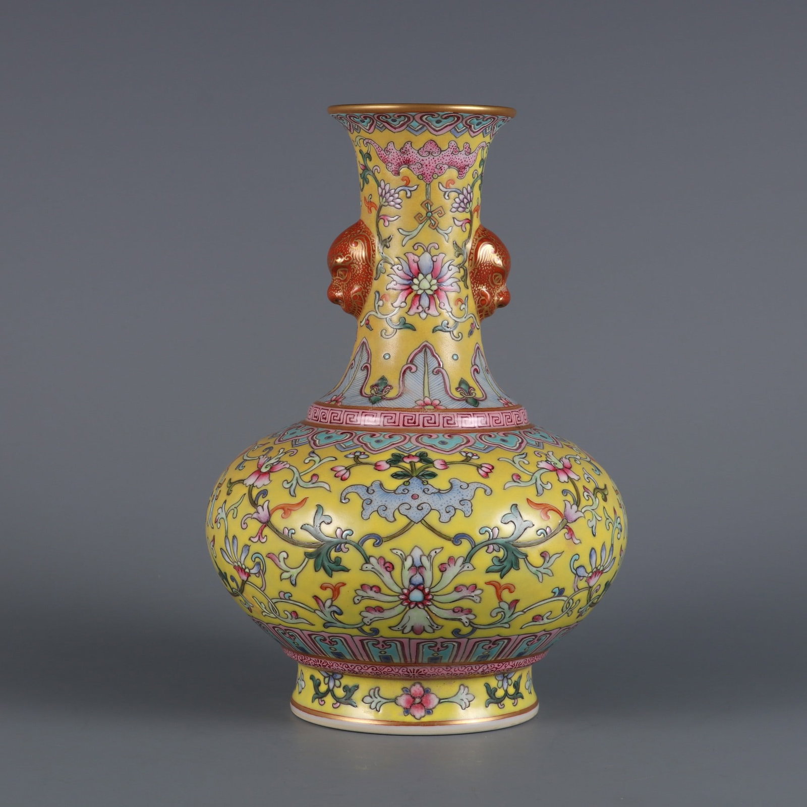 An Exquisite Yellow Ground Famille-Rose Painted Gold Lotus and Bats Pattern Beast-Ears Vase: An Exquisite Yellow Ground Famille-Rose Painted Gold Lotus and Bats Pattern Beast-Ears Vase,Qing Dynasty, China,Qianlong Six-character Mark,Size:8inx2.4in黄地粉彩描ດ
