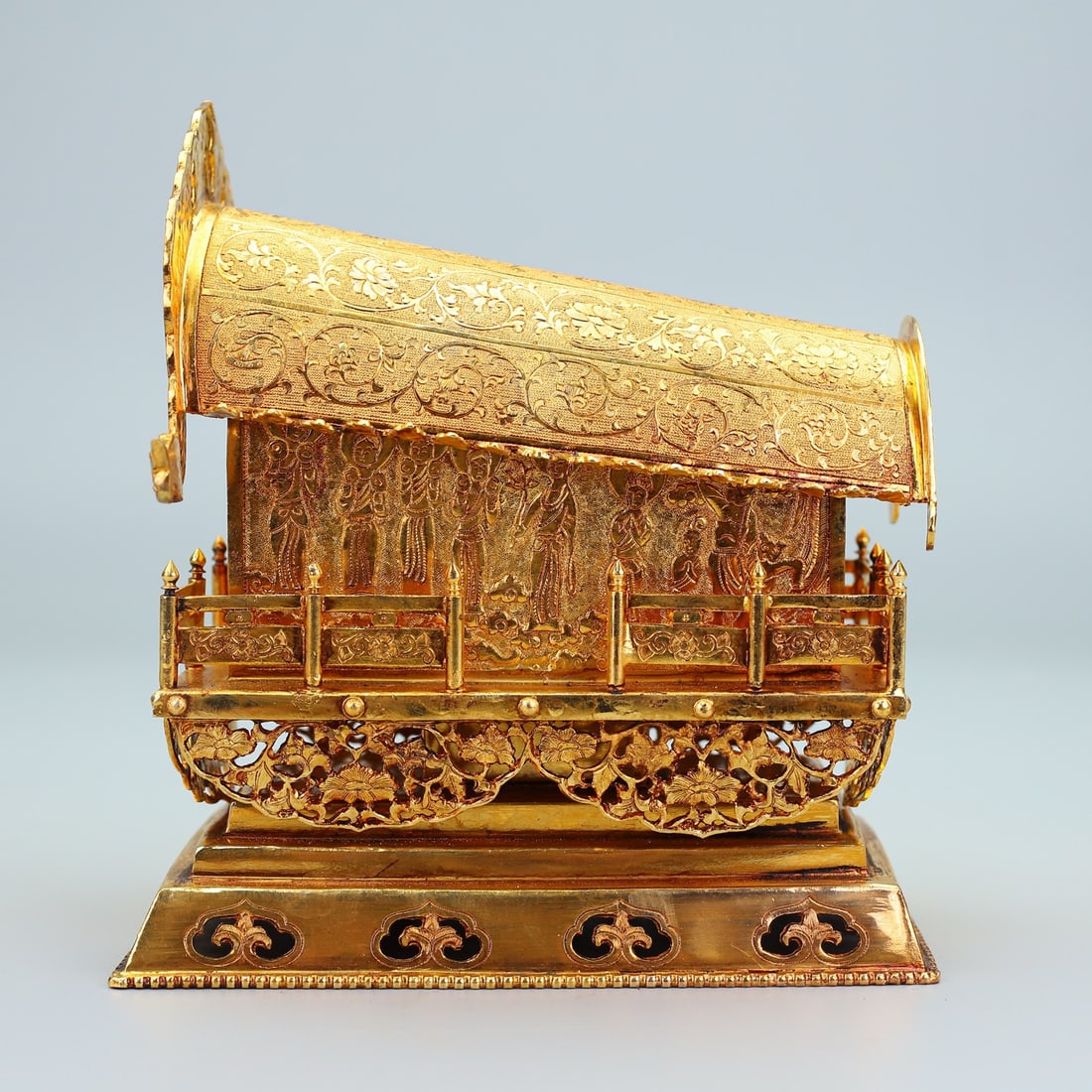 An Exquisite Gilt Silver Figure Pattern Coffin-Shaped Ornament: An Exquisite Gilt Silver Figure Pattern Coffin-Shaped Ornament,Qing Dynasty,China,Size:8.3inx7.5in,Weight:1391g铜镀金人物纹棺材形摆件&