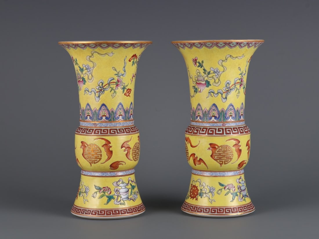 A Pair of Exquisite Yellow Ground Famille-Rose Painted Gold Eight Treasures,Bats and Peach Pattern: A Pair of Exquisite Yellow Ground Famille-Rose Painted Gold Eight Treasures,Bats and Peach Pattern Vases,Qing Dynasty, China,Qianlong Four-character Mark,Size:9inx4.7in一对黄地