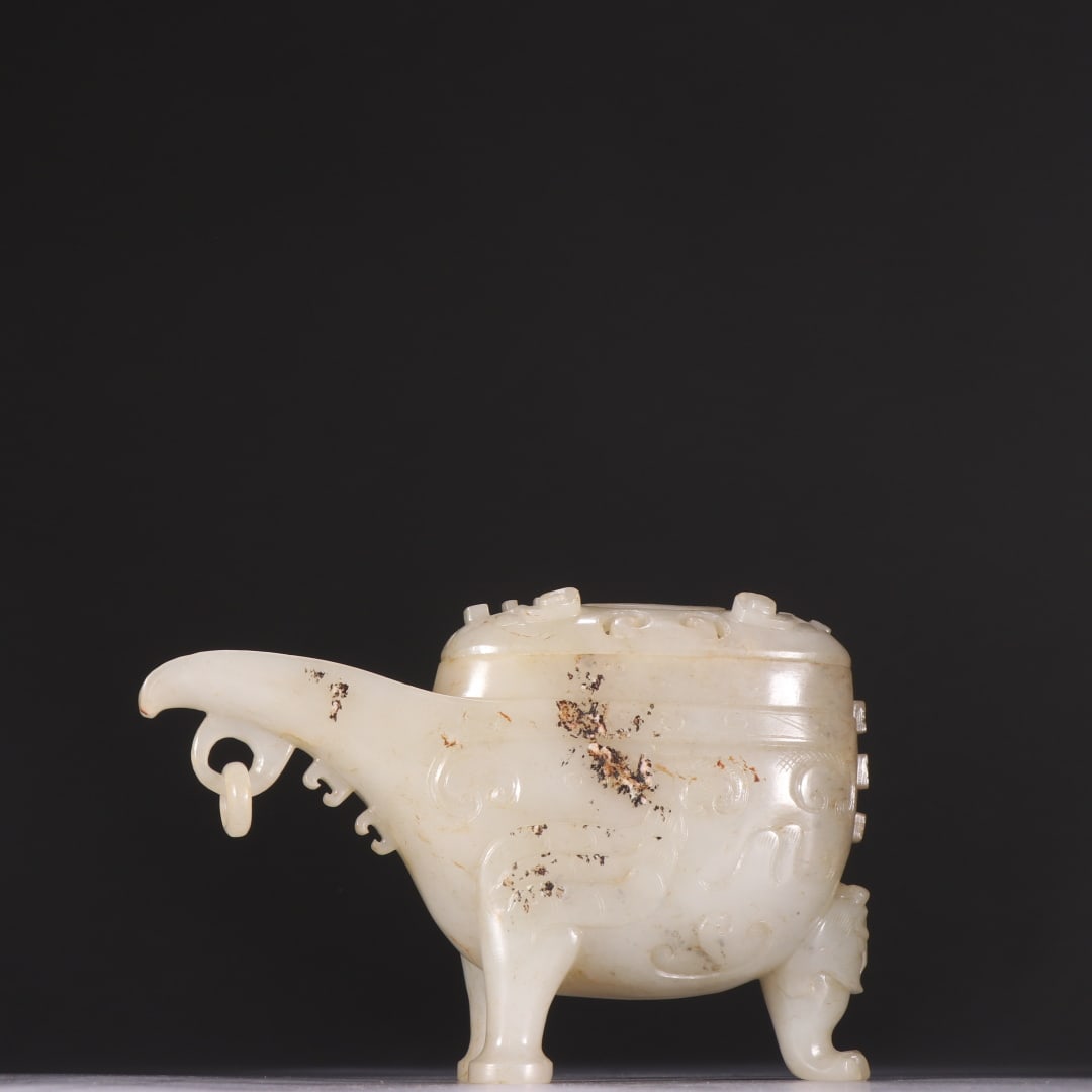 An Exquisite White Jade Tripod Cup: An Exquisite White Jade Tripod Cup,Qing Dynasty,China,Size:5.8inx3.7in,Weight:346.1g白玉三足杯,中国清代,Size:14.7cmx9.4cm,Weight:346.1g