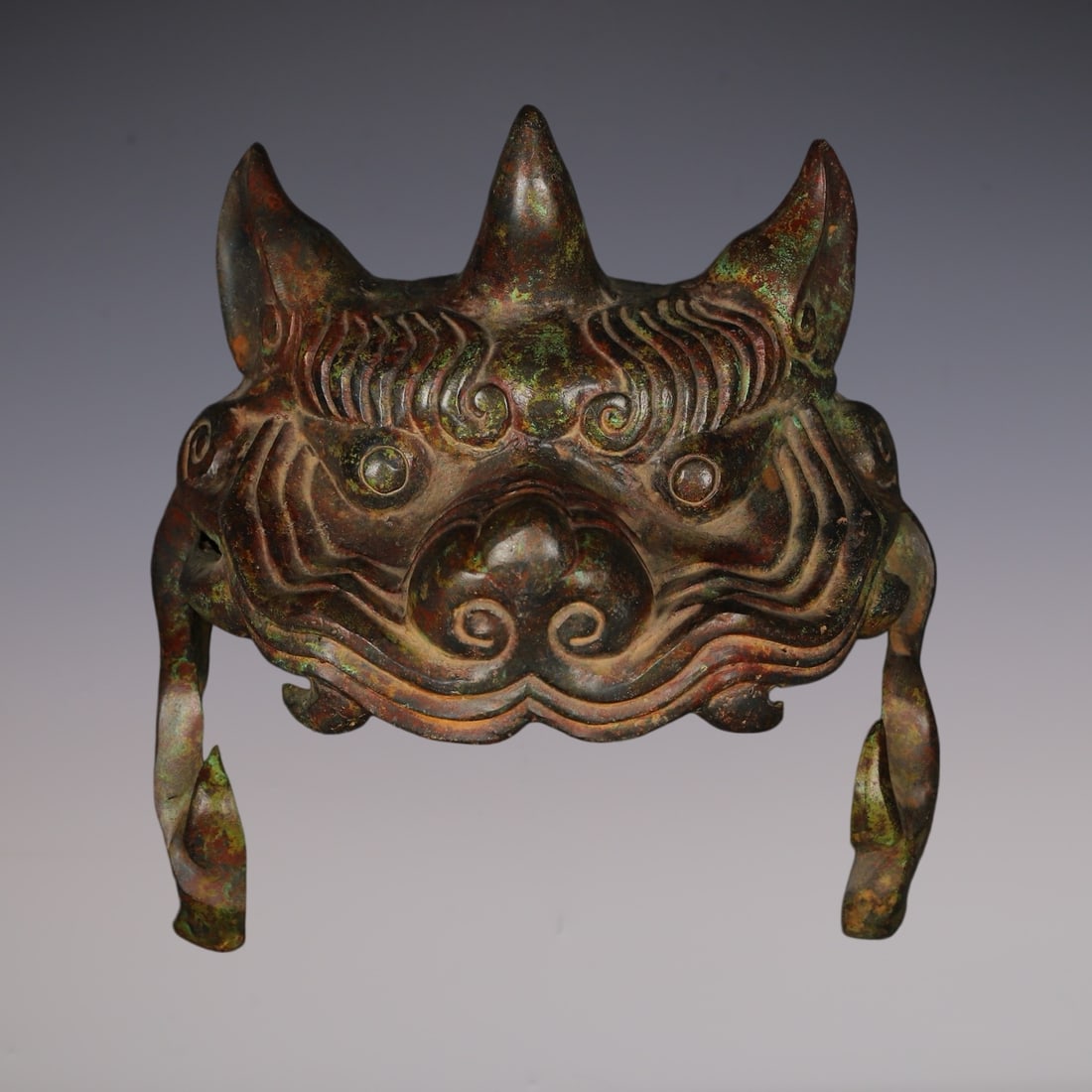 An Archaic Bronze Beast-Shaped Casque: An Archaic Bronze Beast-Shaped Casque,Han Dynasty, China,Size:8.7inx5.9in,Weight:2150g青铜兽形头盔,中国汉代,Size:22cmx15cm,Weight:2150g