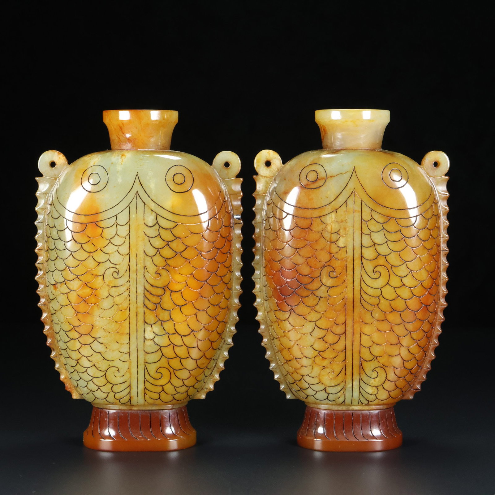 A Pair of Exquisite White Jade Fish Pattern Double-Ears Vases: A Pair of Exquisite White Jade Fish Pattern Double-Ears Vases,Qing Dynasty,China,Size:3.9inx6.7inx2in,Total Weight:589g一对白玉鱼纹双耳瓶,中
