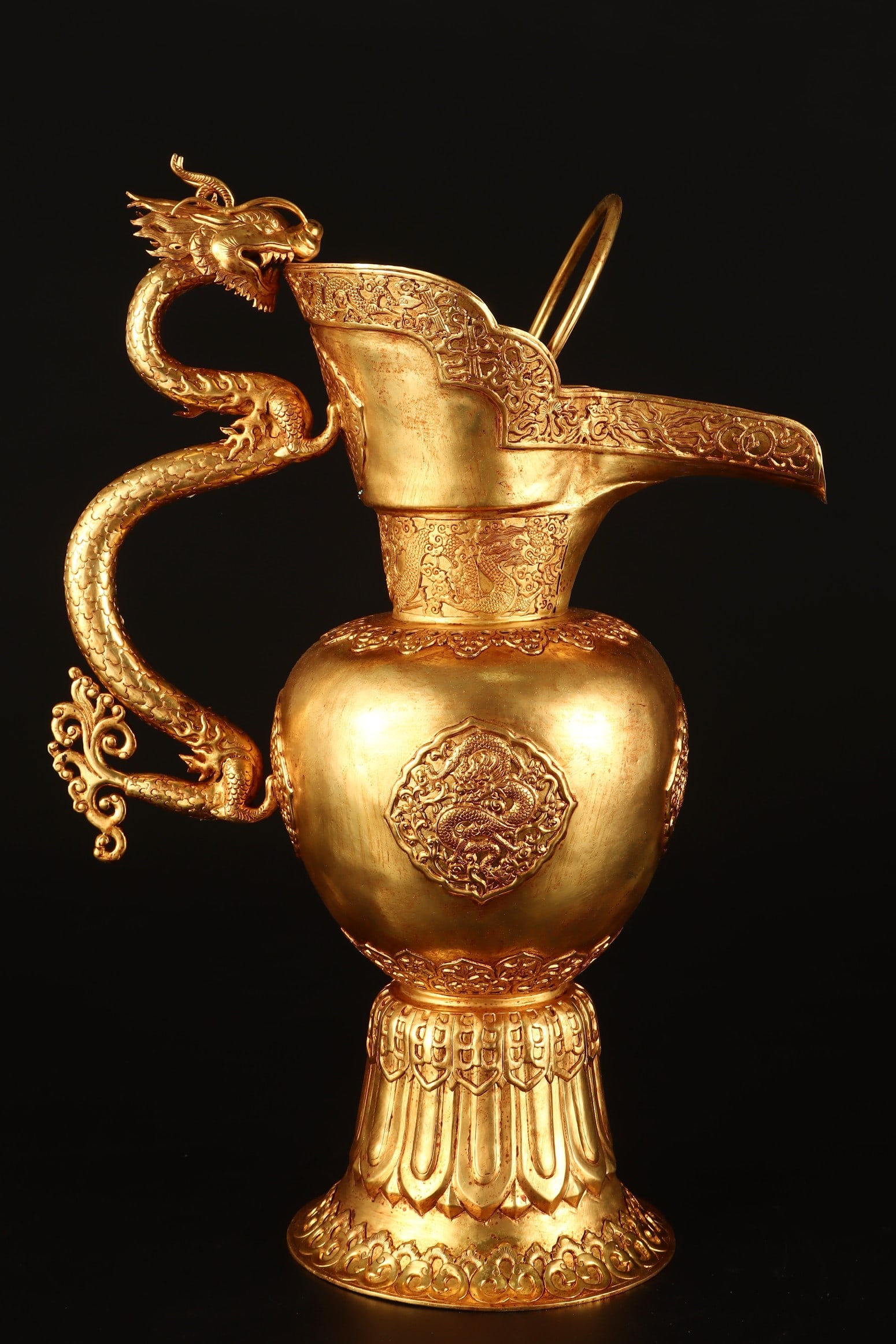 A Rare Gilt Bronze Auspicious Cloud and Dragon Pattern Dragon Handle Ewer: A Rare Gilt Bronze Auspicious Cloud and Dragon Pattern Dragon Handle Ewer,Qing Dynasty,China,Qianlong Four-character Mark,Size:15.4inx10.2in,Weight:1920g铜鎏金祥云龙
