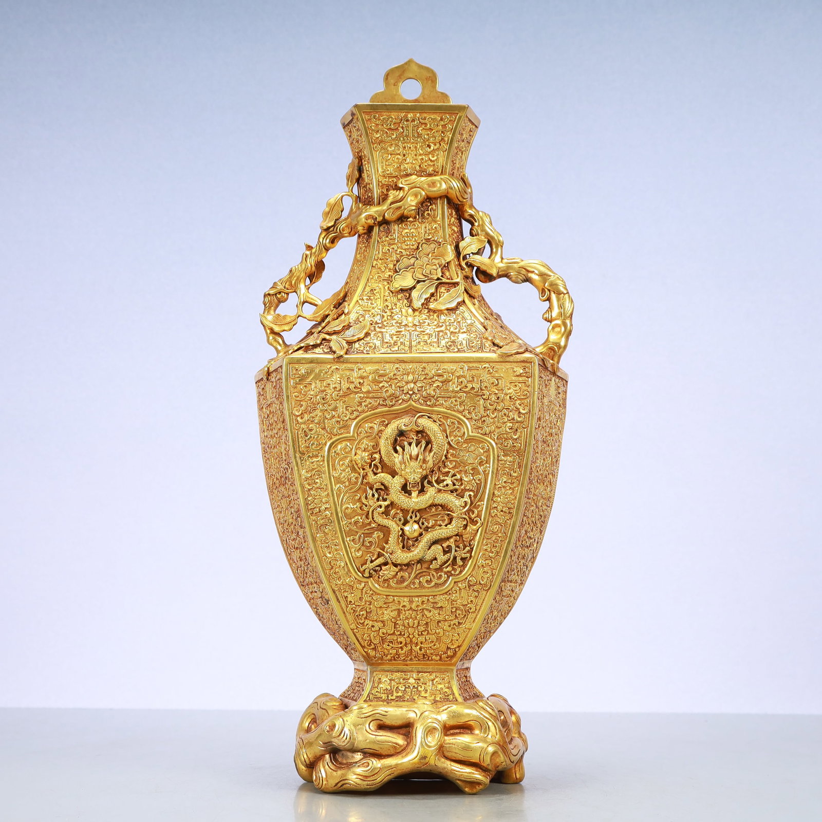 A Exquisite Gilt Bronze Lotus Pattern Dragon Pattern Double-Ears Vase: A Exquisite Gilt Bronze Lotus Pattern Dragon Pattern Double-Ears Vase Qing Dynasty, China Qianlong Six-character Mark Size:7.5inx2.8inx17.1in Weight:4150g铜鎏金缠枝ഫ