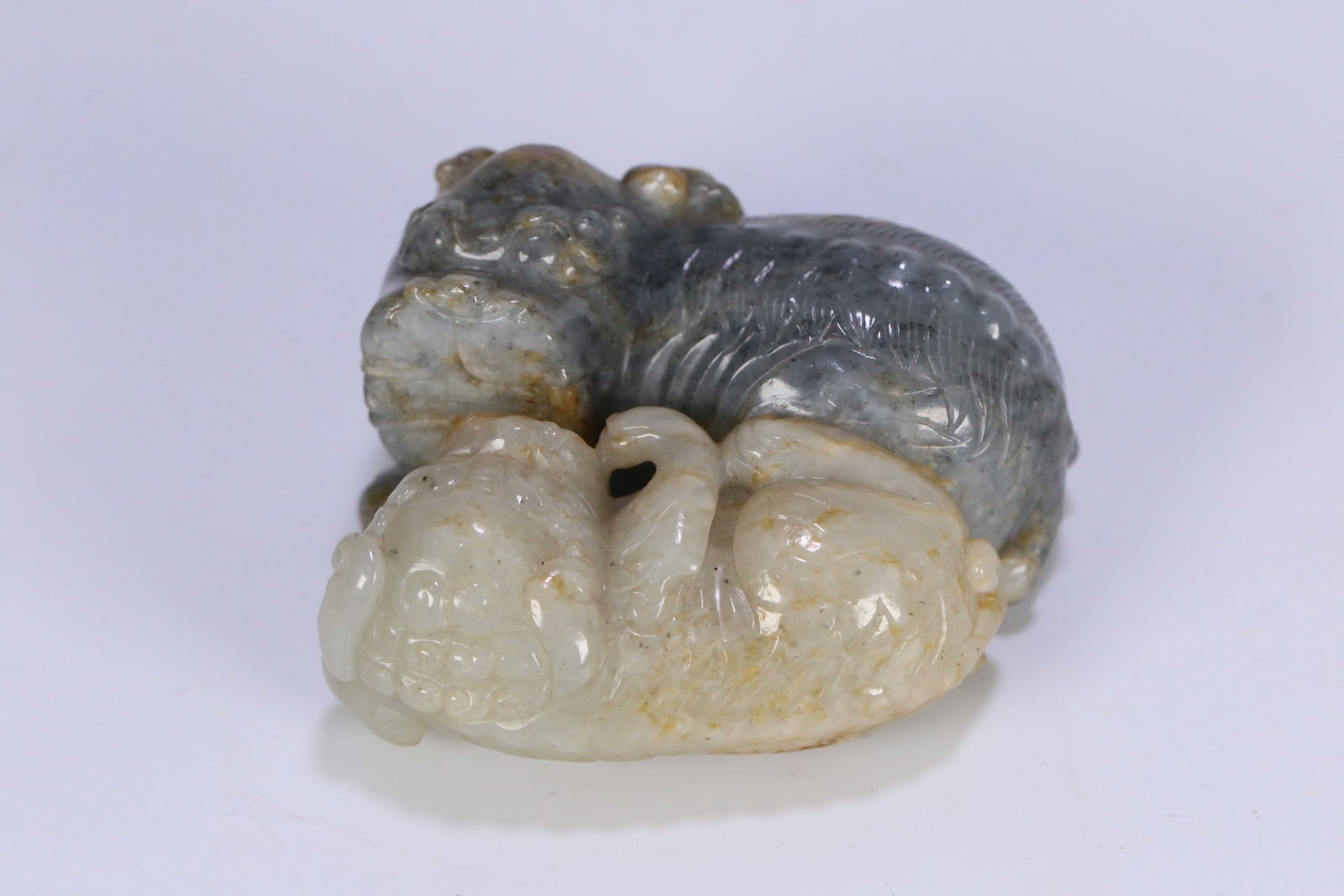 An Exquisite Black and White Jade Lion Ornament (1 of 9)