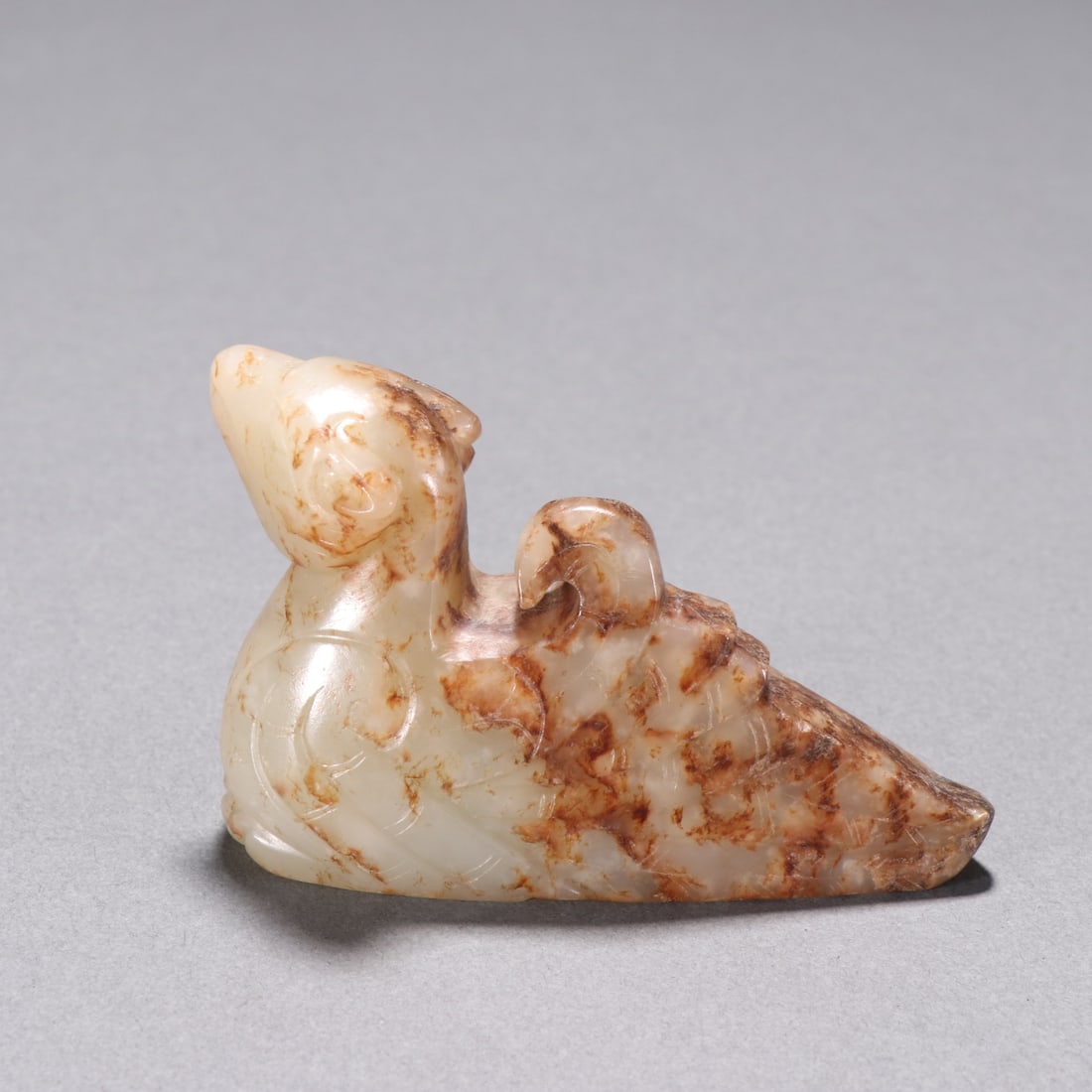 An Exquisite Archaic Jade Bird Ornament: An Exquisite Archaic Jade Bird Ornament,Han Dynasty,China,Size:3.2inx2.1in,Weight:138g高古玉鸟摆件,中国汉代,Size:8.15cmx5.3cm,Weight:138g