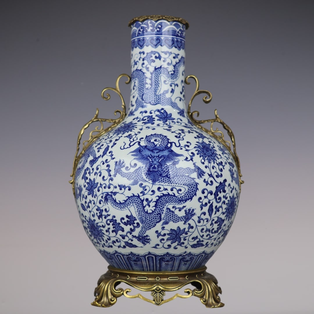 A Huge Blue and White Inlaid Bronze Lotus and Dragon Pattern Double-Ears Vase: A Huge Blue and White Inlaid Bronze Lotus and Dragon Pattern Double-Ears Vase,Qing Dynasty,China,Qianlong Six-character Mark,Size:20.9inx12.6inx9.1in青花镶铜缠枝