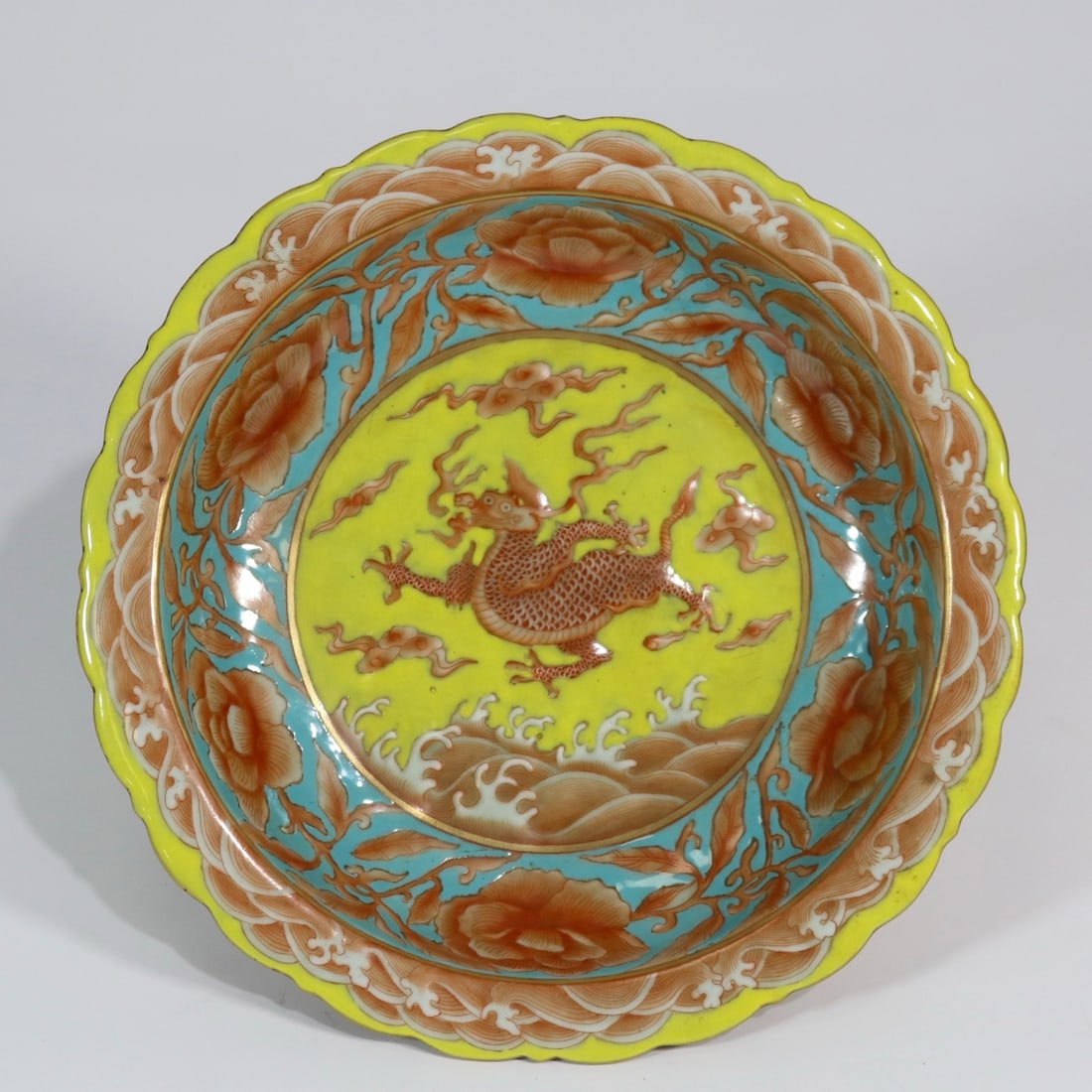 An Exquisite Iron-Red Glazed Yellow Ground Lotus and Auspicious Beast Pattern Plate (1 of 9)