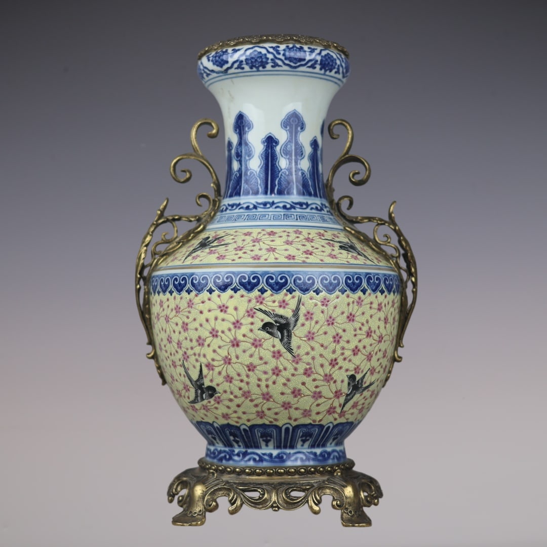 A Huge Blue and White Famille-Rose Inlaid Bronze Flower and Bird Pattern Double-Ears Vase: A Huge Blue and White Famille-Rose Inlaid Bronze Flower and Bird Pattern Double-Ears Vase,Qing Dynasty,China,Qianlong Six-character Mark,Size:16.9inx9.8inx7.7in青花粉彩镶
