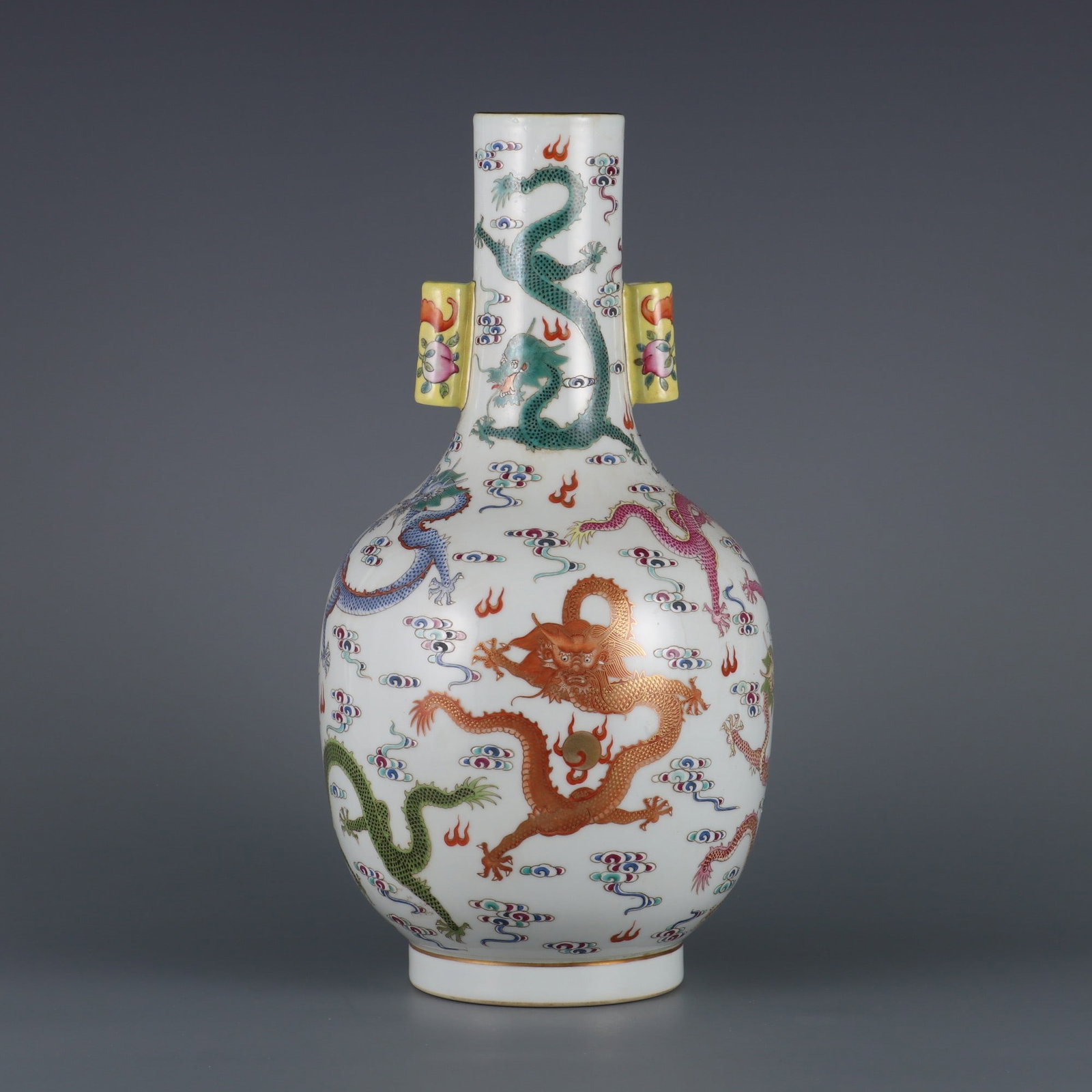 A Rare Famille-Rose Painted Gold Auspicious Cloud and Dragon Pattern Double-Ears Vase: A Rare Famille-Rose Painted Gold Auspicious Cloud and Dragon Pattern Double-Ears Vase,Qing Dynasty, China,Qianlong Six-character Mark,Size:12.8inx2.2in粉彩描金祥云&