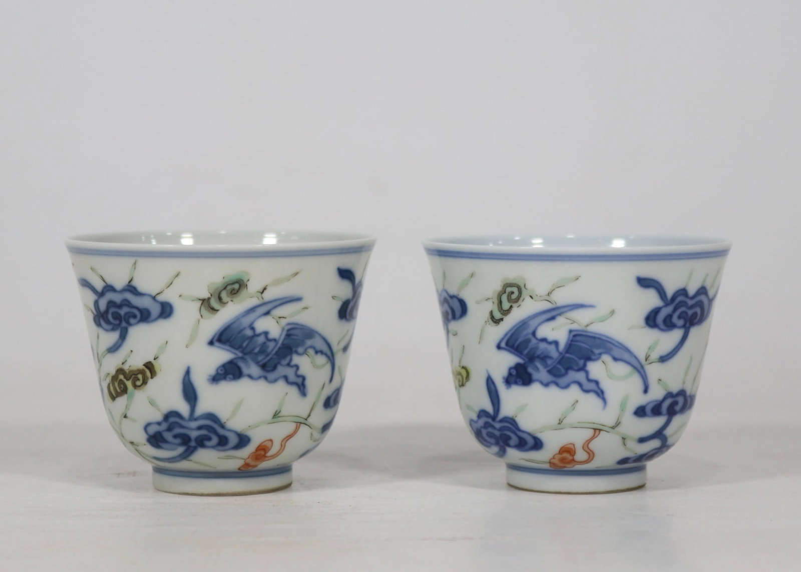 A Pair of Exquisite Blue and White Wucai Bats and Ganoderma lucidum Pattern Cups: A Pair of Exquisite Blue and White Wucai Bats and Ganoderma lucidum Pattern Cups,Qing Dynasty, China,Kangxi Six-character
