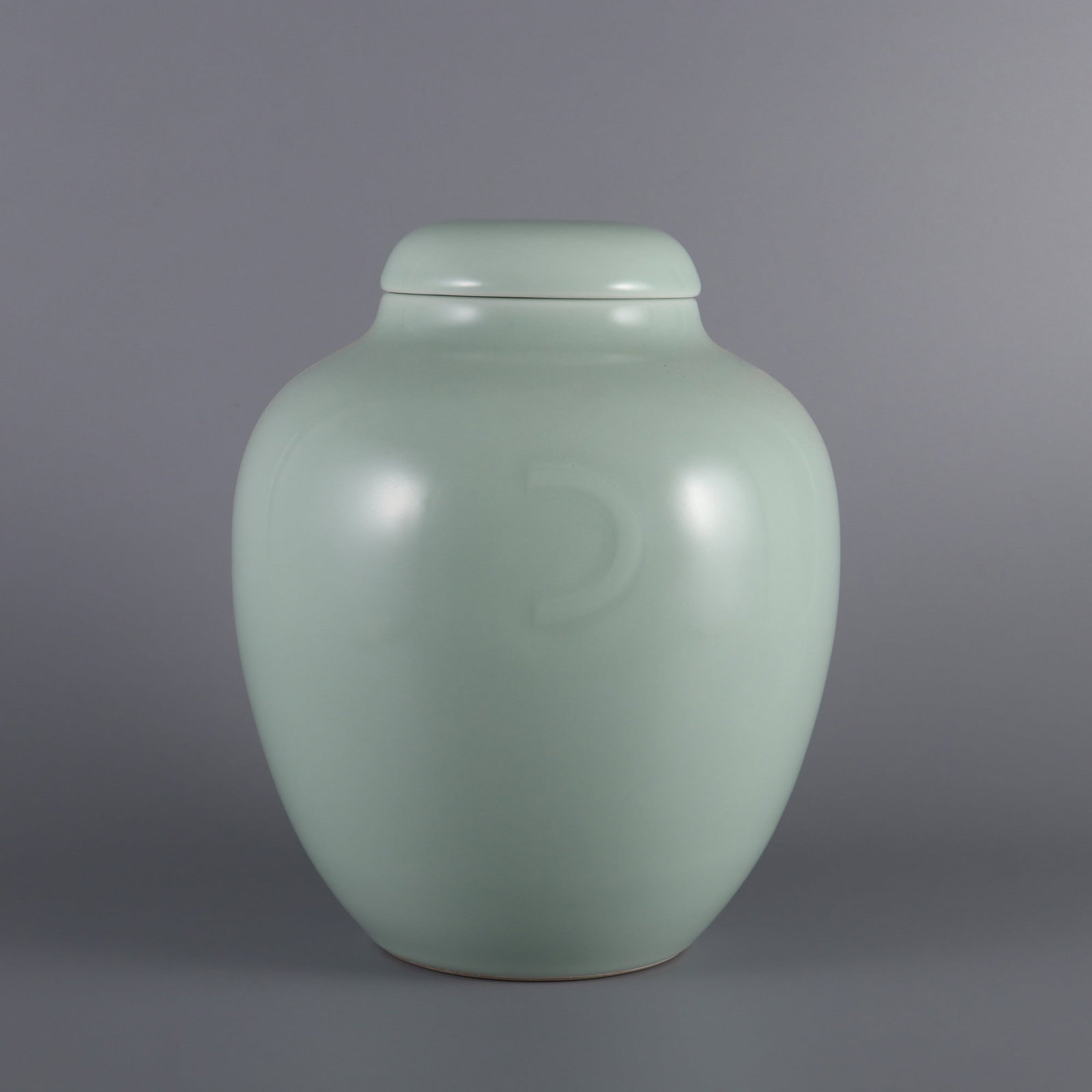 An Exquisite Celadon Glazed Crescent Pattern Jar with Cover (1 of 9)
