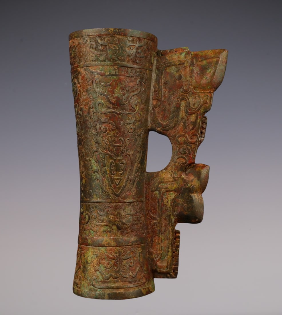 An Archaic Bronze Beast-Face Pattern Cup: An Archaic Bronze Beast-Face Pattern Cup,W.Zhou , China,Size:6.3inx9.4in,Weight:1100g青铜兽面纹杯,中国西周时期,Size:16cmx24cm,We