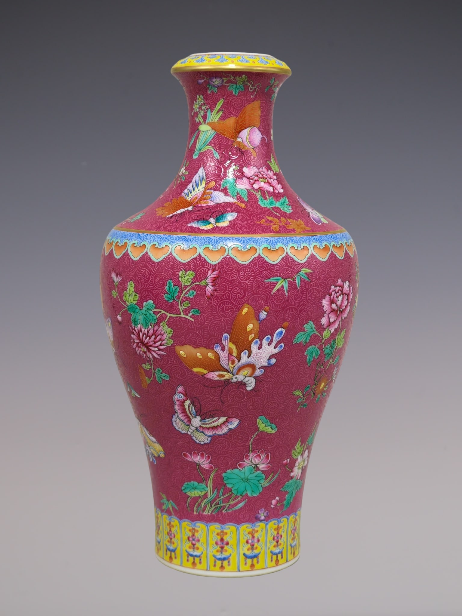 A Rare Famille-Rose Ruby Red-Glazed Painted Gold Flower and Butterfly Pattern Vase: A Rare Famille-Rose Ruby Red-Glazed Painted Gold Flower and Butterfly Pattern Vase,Qing Dynasty, China,Qianlong Six-character Mark,Size:12.8inx6.7in粉彩胭脂红釉