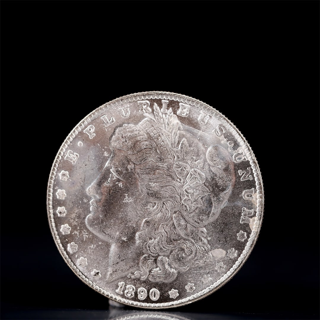 USA Morgan Dollar 1890 Coin: Obv: profile bust with date below and E PLURIBUS UNUM legend and stars around. Rev: eagle with In God we trust above within wreath with UNITED STATES OF AMERICA ONE DOLLAR legend. IN GOD WE TRUST /