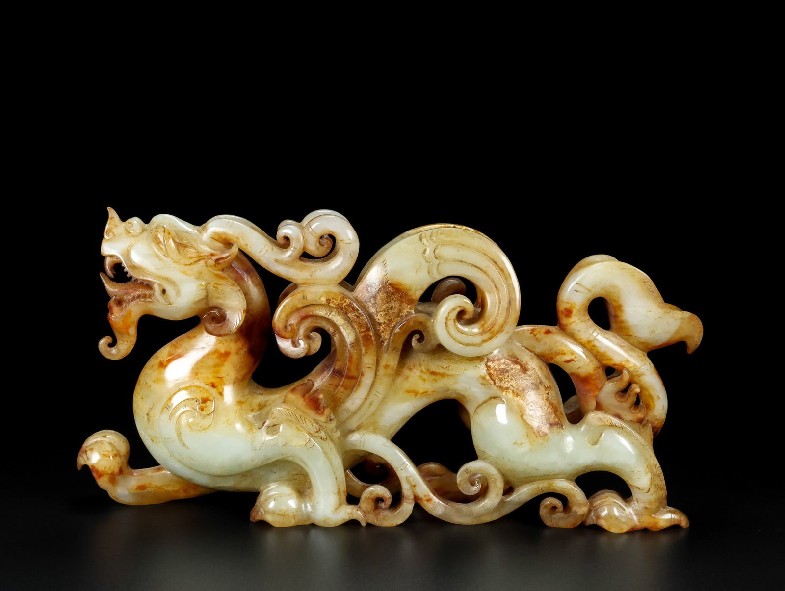 An Exquisite White Jade Auspicious Beast Ornament: An Exquisite White Jade Auspicious Beast Ornament,Qing Dynasty,China,Size:9.4inx4.7inx2.4in,Weight:1166g白玉瑞兽摆件,中国清代,Size:24cmx12cm