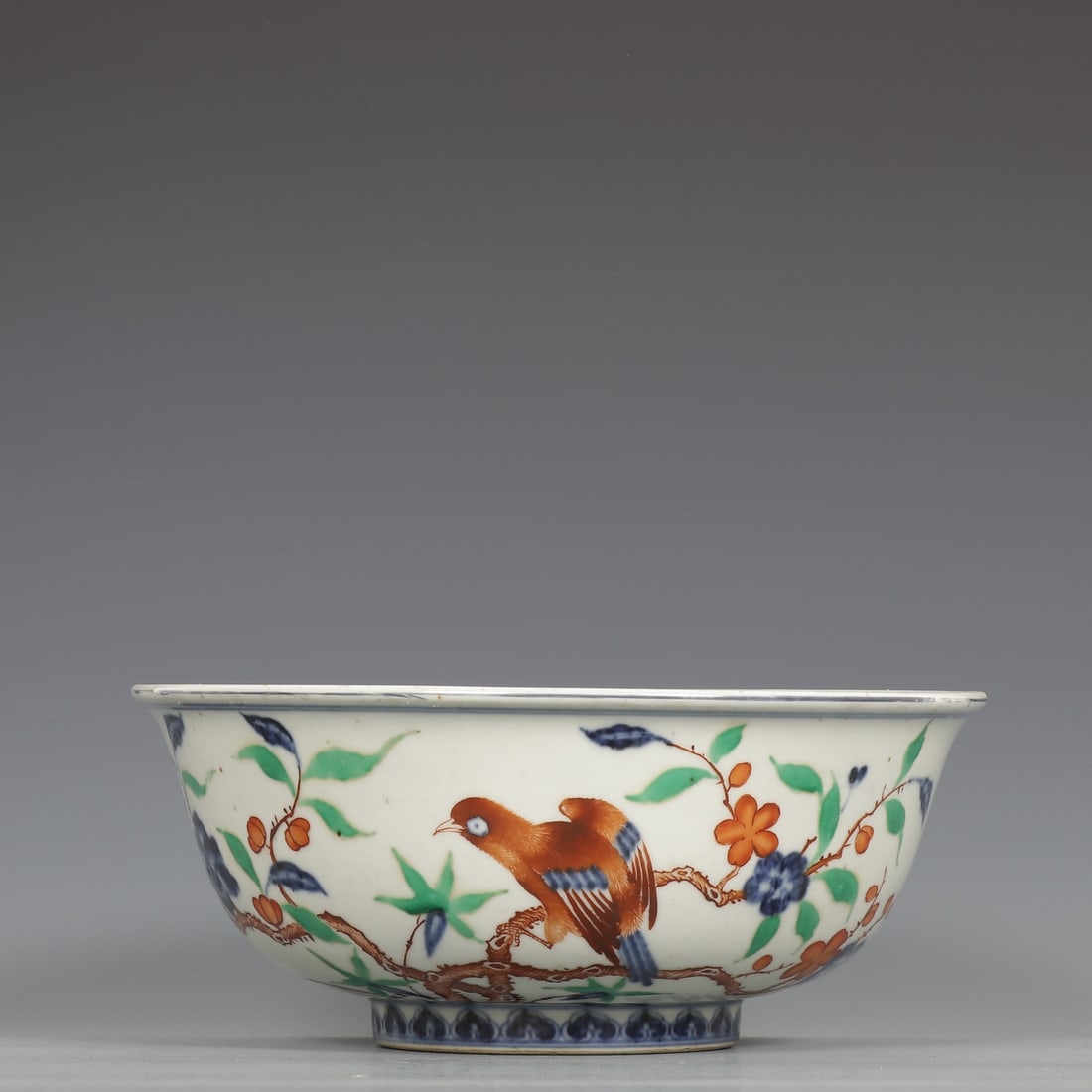 An Exquisite Blue and White Wucai Flower and Bird Pattern Bowl: An Exquisite Blue and White Wucai Flower and Bird Pattern Bowl,Ming Dynasty,China,Xuande Six-character Mark,Size:4.6inx10.9in青花五彩花鸟纹碗,中&#