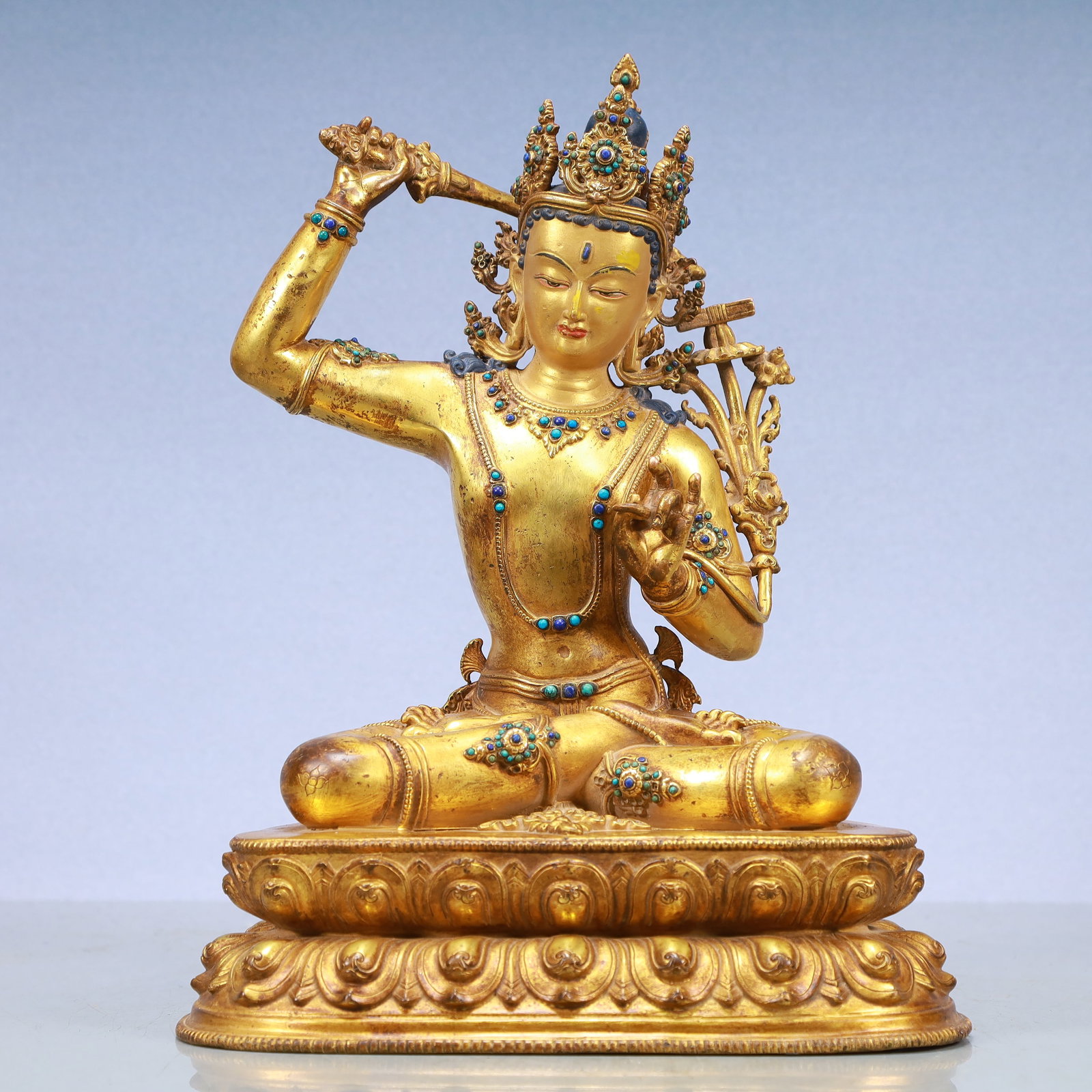 A Exquisite Gilt Bronze Statue of Manjusri: A Exquisite Gilt Bronze Statue of Manjusri Ming Dynasty, China Size:9.8inx6.3inx13in Weight:4700g铜鎏金文殊菩萨 中国明代 Size:25cmx16c