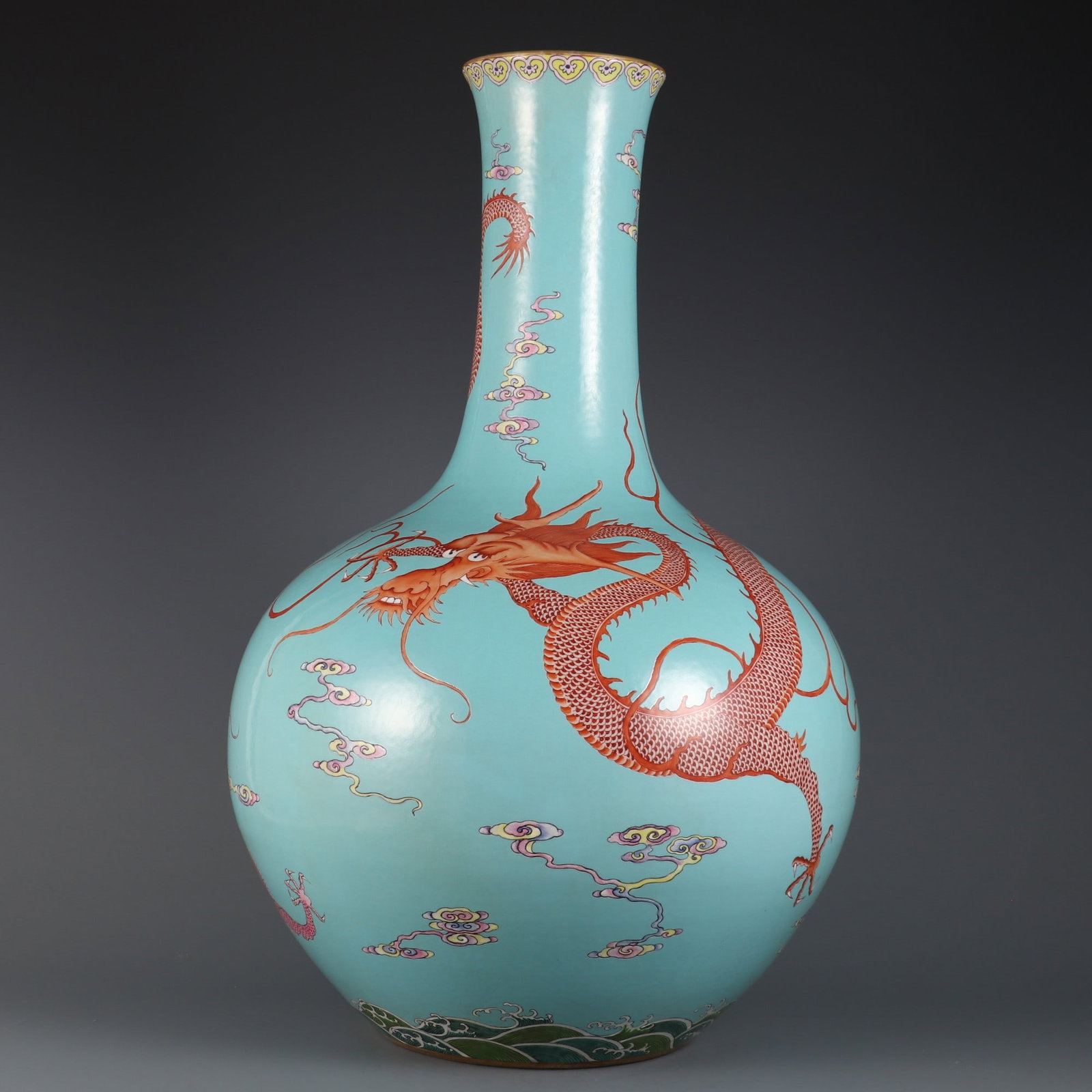 A Huge Turquoise Ground Famille-Rose Painted Gold Seawater,Auspicious Cloud and Dragon Pattern Vase: A Huge Turquoise Ground Famille-Rose Painted Gold Seawater,Auspicious Cloud and Dragon Pattern Vase,Qing Dynasty, China,Qianlong Six-character Mark,Size:22.4inx14.2inx4.6in松石绿