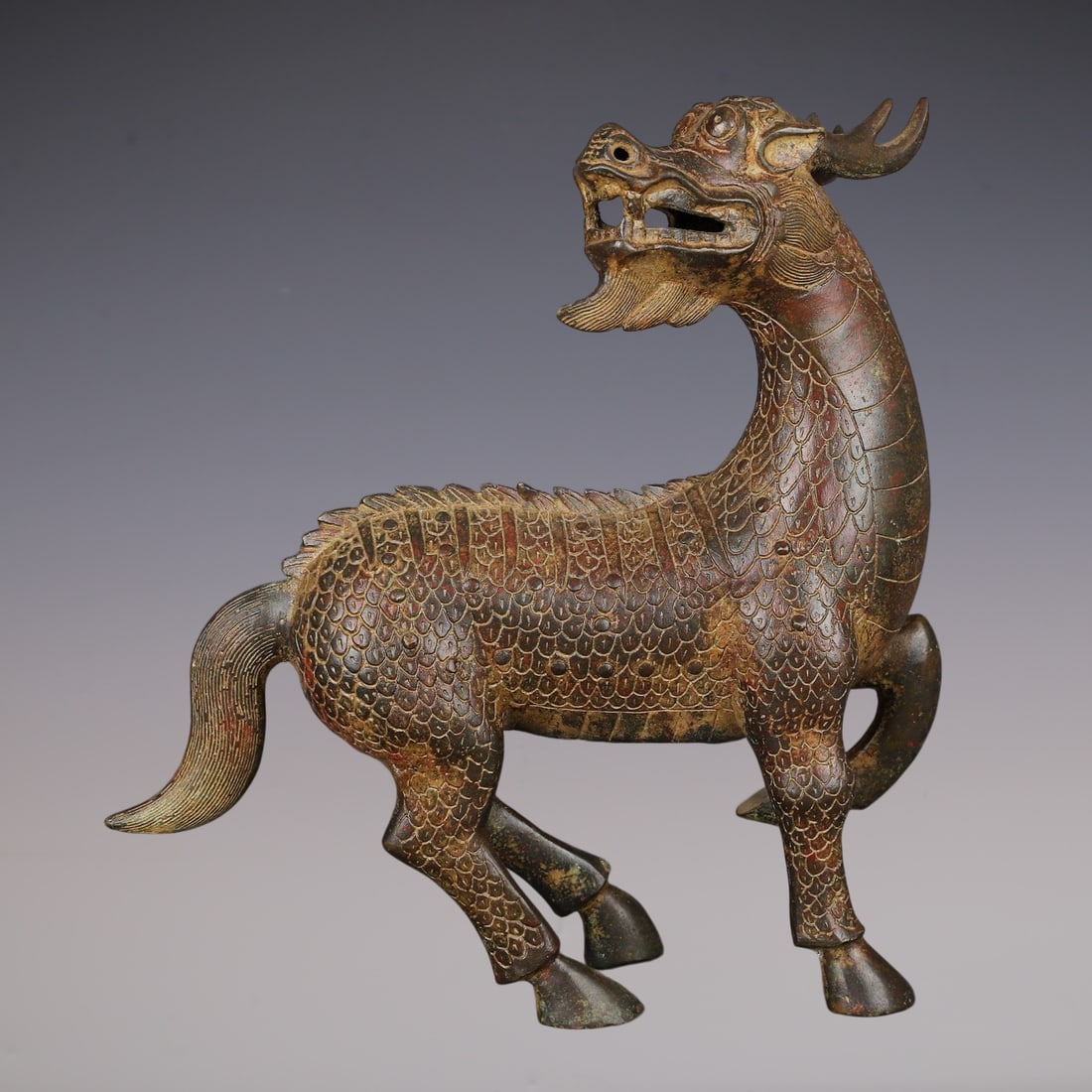 An Archaic Bronze Dragon Horse Ornament: An Archaic Bronze Dragon Horse Ornament,Han Dynasty, China,Size:6.3inx3.1inx11in,Weight:2080g青铜龙马摆件,中国汉代,Size:16cmx8cmx28cm,Weight