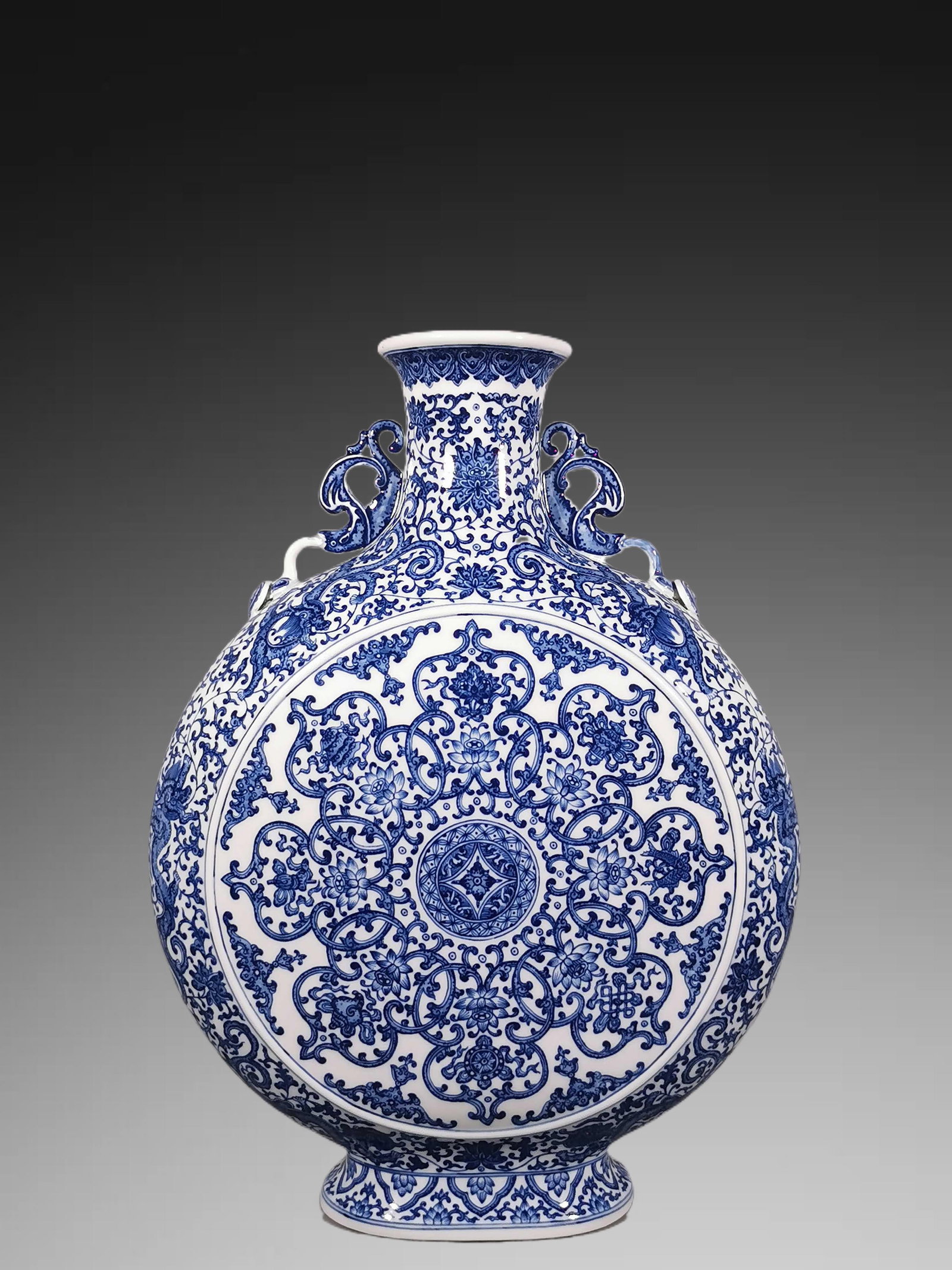 An Exquisite Blue and White Lotus Eight Treasures Pattern Double-Ears Vase: An Exquisite Blue and White Lotus Eight Treasures Pattern Double-Ears Vase,Qing Dynasty, China,Qianlong Six-character Mark,Size:20.3inx4.5inx15.2in 青花缠枝莲纹