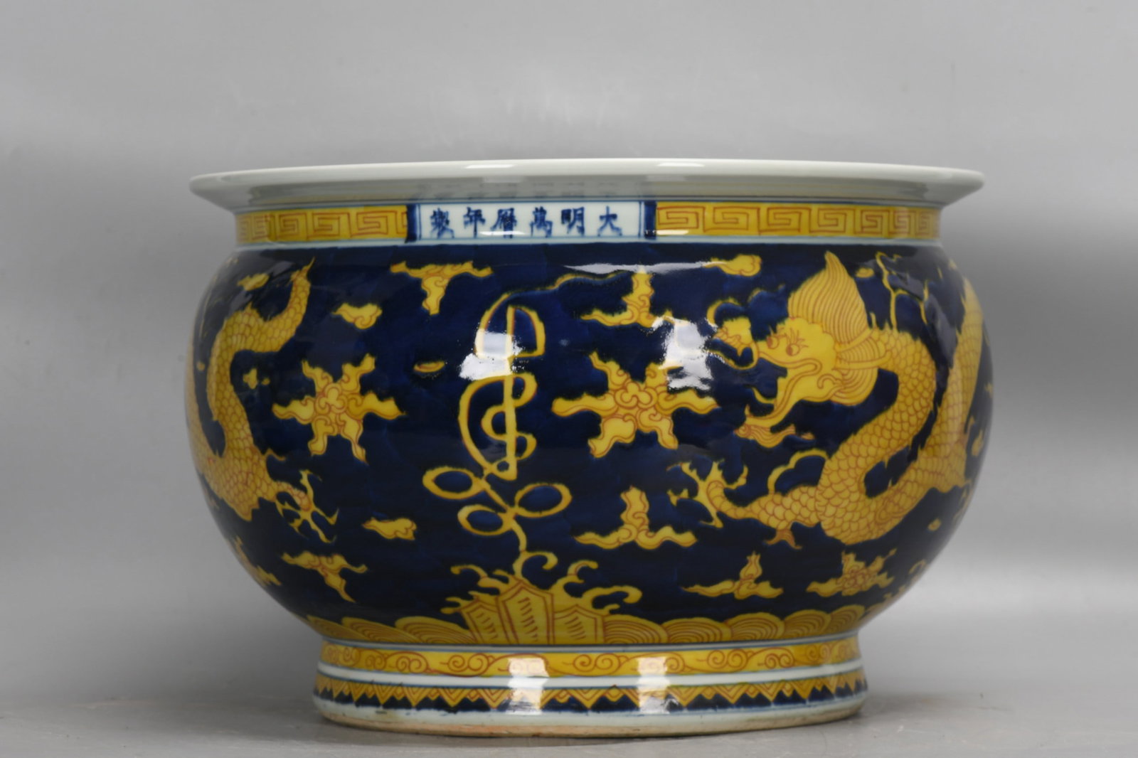 An Exquisite Blue Ground Yellow Color Dragon Pattern Vat: An Exquisite Blue Ground Yellow Color Dragon Pattern Vat,Ming Dynasty, China,Wanli Six-character Mark,Size:11inx15.7in