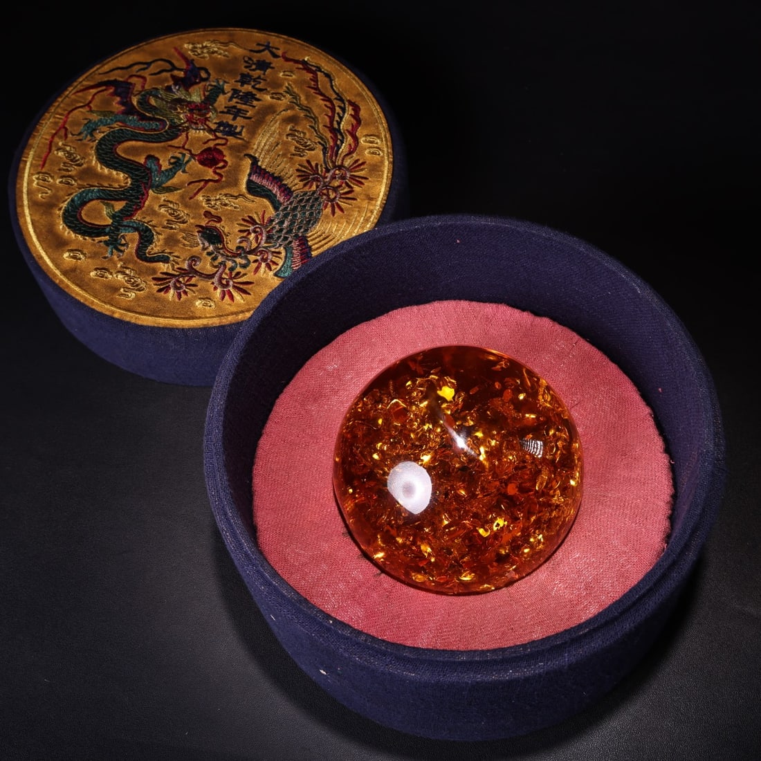 An Exquisite Amber Sphere: An Exquisite Amber Sphere,Qing Dynasty, China,Size:3.9in,Weight:700g 琥珀球,中国清代