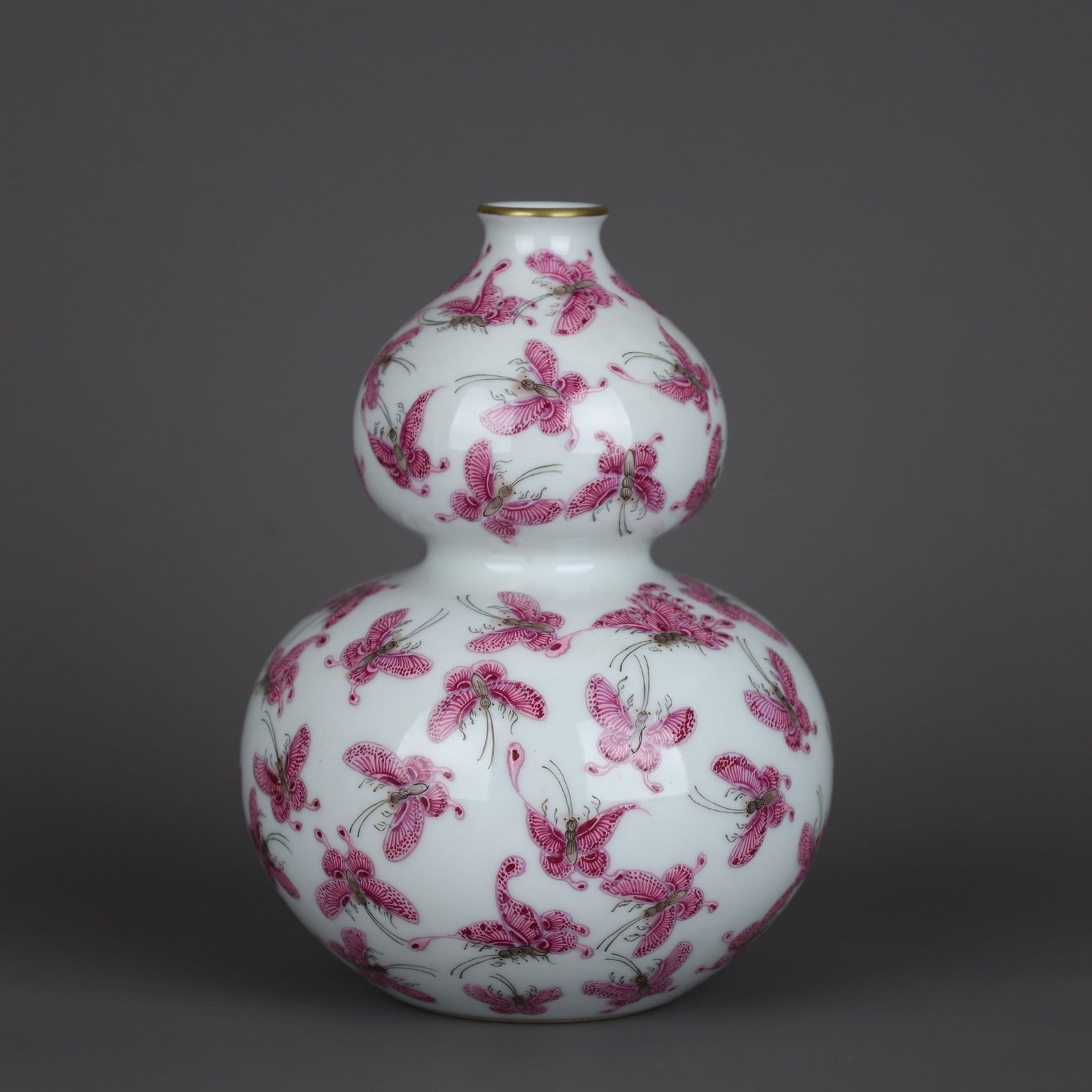 An Exquisite Famille-Rose Ruby Red-Glazed Butterfly Pattern Gourd Vase: An Exquisite Famille-Rose Ruby Red-Glazed Butterfly Pattern Gourd Vase,Qing Dynasty, China,Yongzheng Six-character Mark,Size:5.2inx3.8in 粉彩胭脂红蝶纹葫
