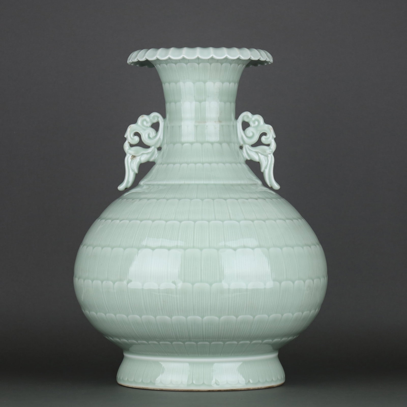 An Exquisite Pea-Green Glaze Double-Ears Vase: An Exquisite Pea-Green Glaze Double-Ears Vase,Qing Dynasty, China,Qianlong Six-character Mark,Size:17.1inx13.2in 豆青釉双耳瓶,中国清代,È