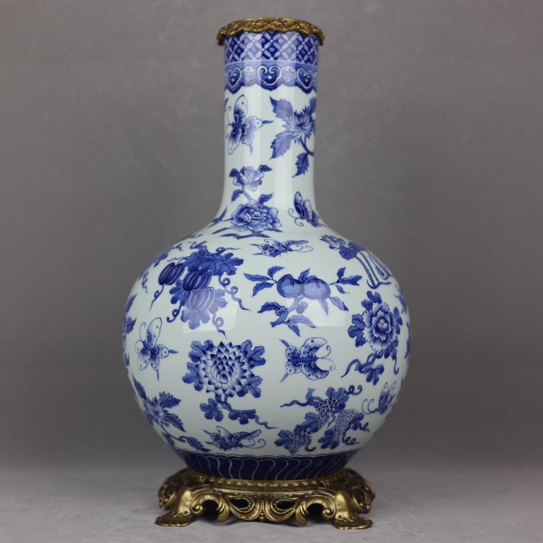 An Exquisite Blue and White Inlaid Bronze Flower and Fruit Pattern Vase: An Exquisite Blue and White Inlaid Bronze Flower and Fruit Pattern Vase,Qing Dynasty, China,Qianlong Six-character Mark,Size:18.1inx4.1inx11inx7.9in 青花镶铜花果