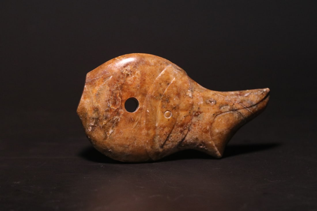 An Exquisite Gaogu Jade Fish: An Exquisite Gaogu Jade Fish,Ancient Time, China,Size:2.7inx1.5inx0.4in,Weight:51.5g 高古玉鱼,远古时期