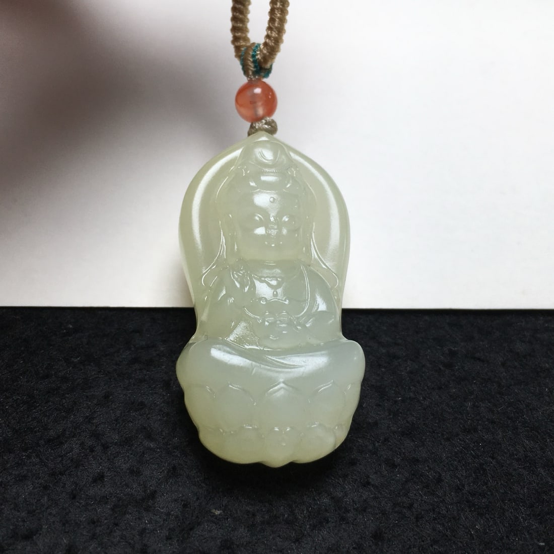 An Exquisite Hotan Jade Buddha Pendant: An Exquisite Hotan Jade Buddha Pendant,Qing Dynasty, China,Size:1.7inx0.9inx4.5in,Weight:19g 和田玉佛挂件,中国清代