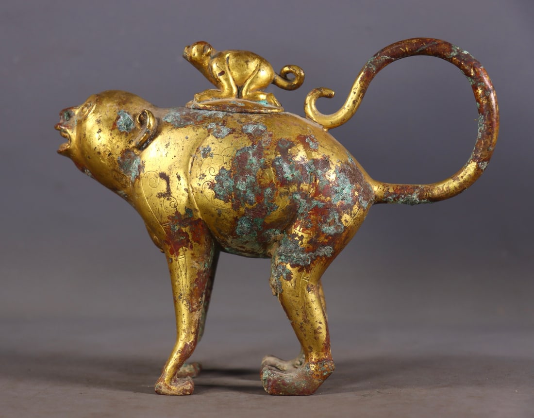 An Exquisite Gilt Bronze Monkey-Shaped Ewer: An Exquisite Gilt Bronze Monkey-Shaped Ewer,Han Dynasty, China,Size:6.1inx7.3inx2.6in,Weight:1093g 铜鎏金猴形壶,中国汉代