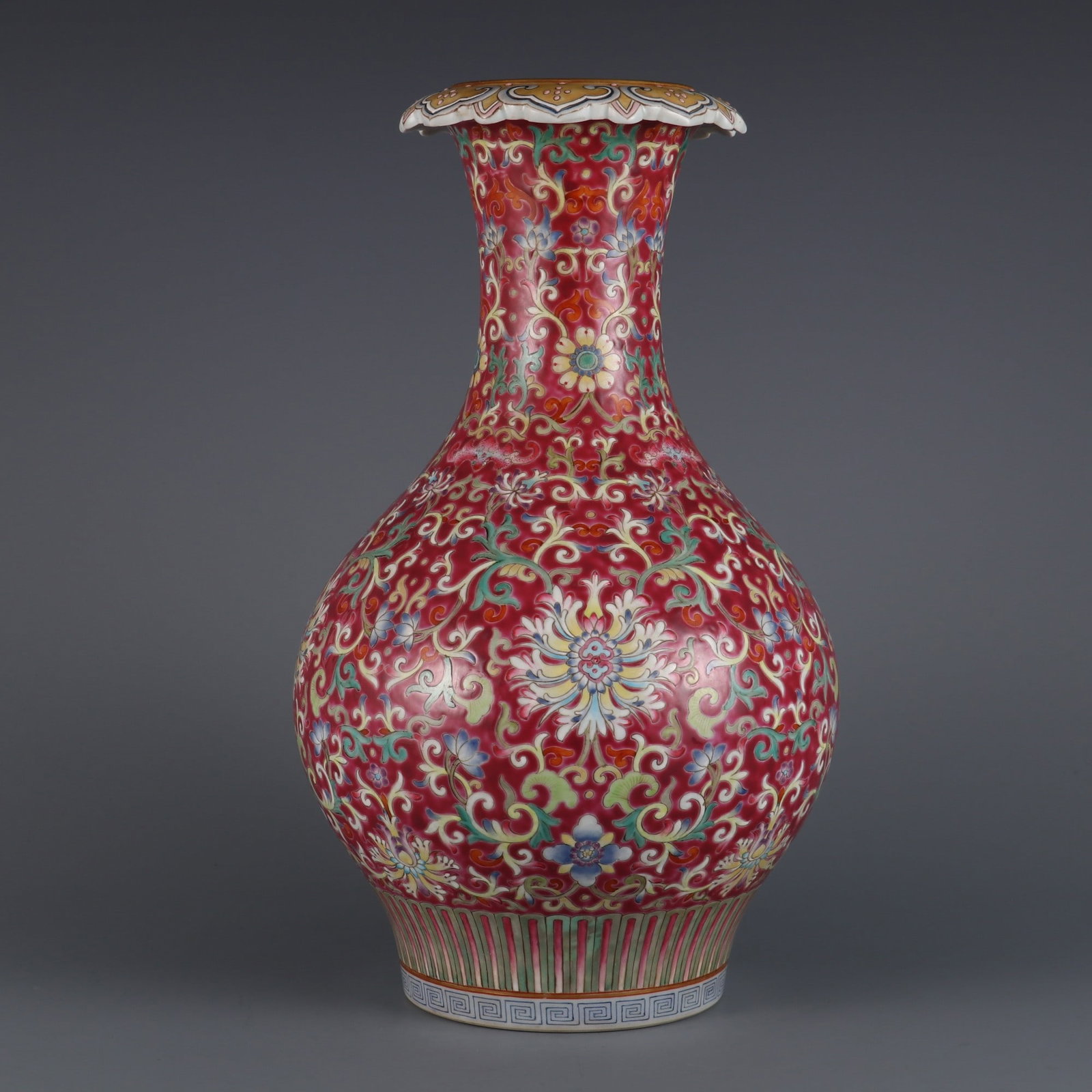 An Exquisite Ruby Red Ground Famille-Rose Lotus Pattern Vase: An Exquisite Ruby Red Ground Famille-Rose Lotus Pattern Vase,Qing Dynasty, China,Qianlong Six-character Mark,Size:13.2inx3.4in