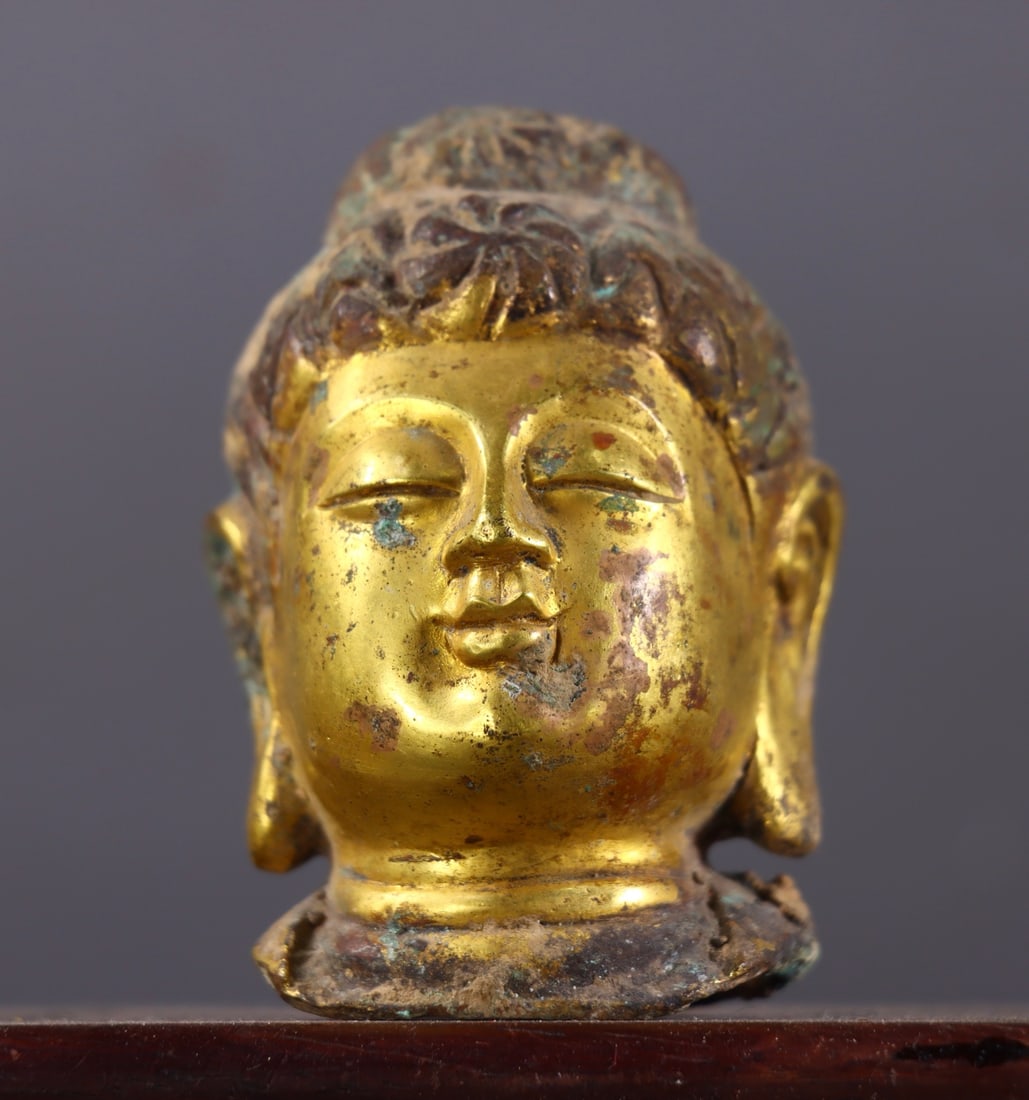 An Exquisite Gilt Bronze Buddha head: An Exquisite Gilt Bronze Buddha head,Ming Dynasty, China,Size:3.1inx2inx1.8in,Weight:200g 铜鎏金佛头,中国明代