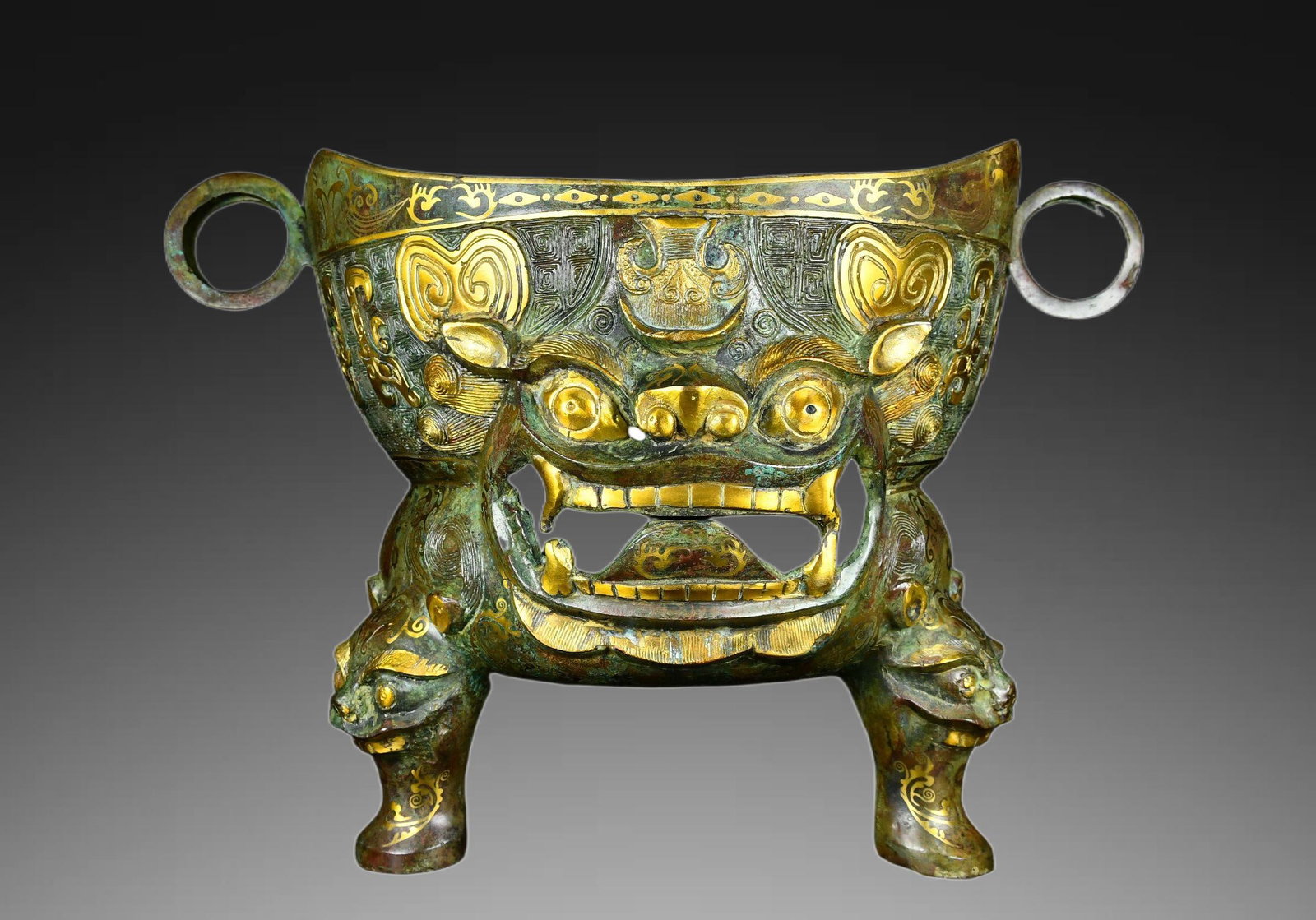 An Exquisite Gold-inlaid Bronze Beast-Face Basin: An Exquisite Gold-inlaid Bronze Beast-Face Basin,Han Dynasty, China,Size:11inx16.5in ,Weight:6900g 青铜错金兽面盆,中国汉代