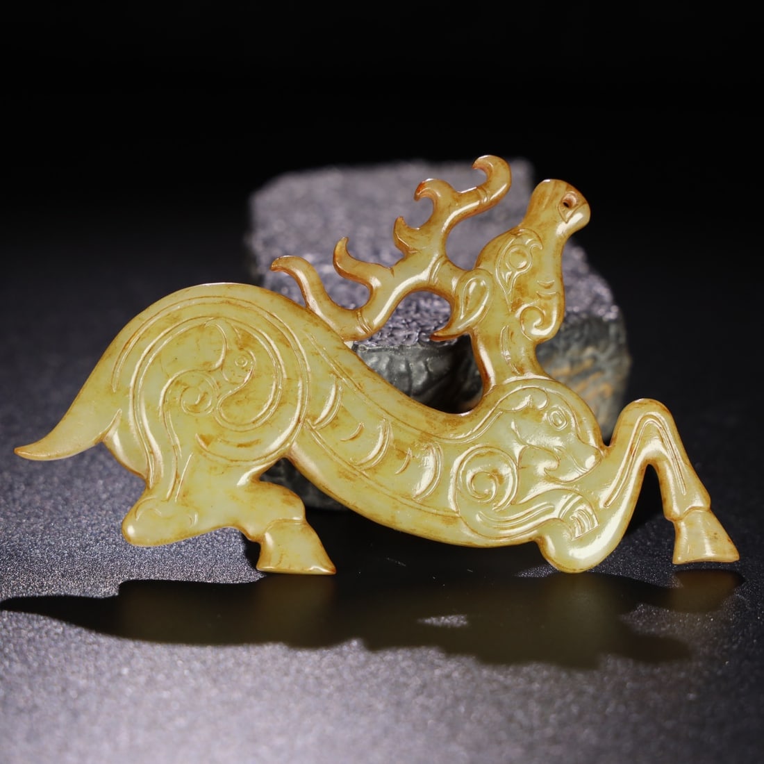 An Exquisite Hotan Yellow Jade Deer Pendant: An Exquisite Hotan Yellow Jade Deer Pendant,Han Dynasty, China,Size:4.6inx2.5inx0.2in,Weight:58g 和田黄玉鹿佩,中国汉代