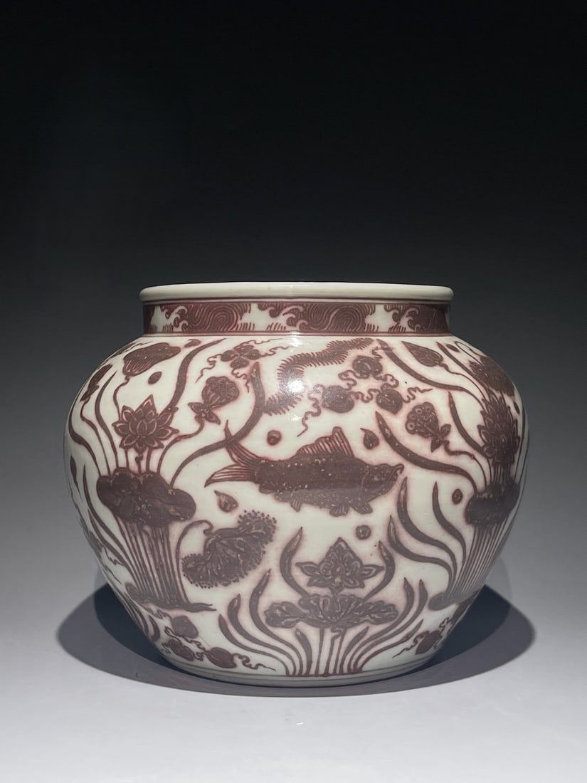 An Exquisite Underglaze-Red Fish and Lotus Pattern Jar: An Exquisite Underglaze-Red Fish and Lotus Pattern Jar,Ming Dynasty, China,Size:7.4inx9.4in 釉里红鱼藻纹罐,中国明代